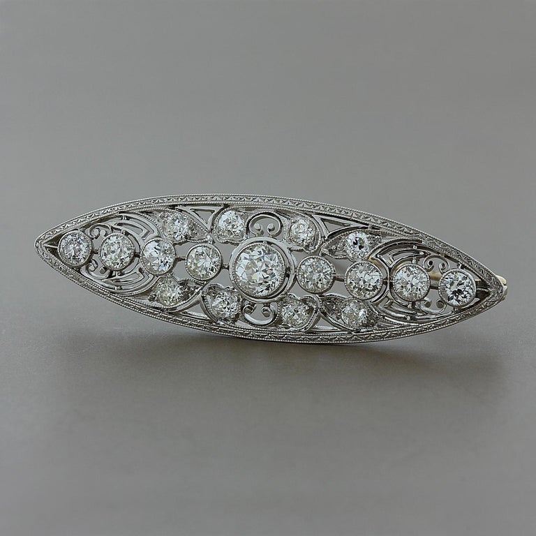 A superb Edwardian brooch from the early 1900's featuring 3 carats of VS quality European cut diamonds. Set in platinum with a 14K yellow gold hinged pin.

Brooch Length: 2 inches
Brooch Width: ½ inch

