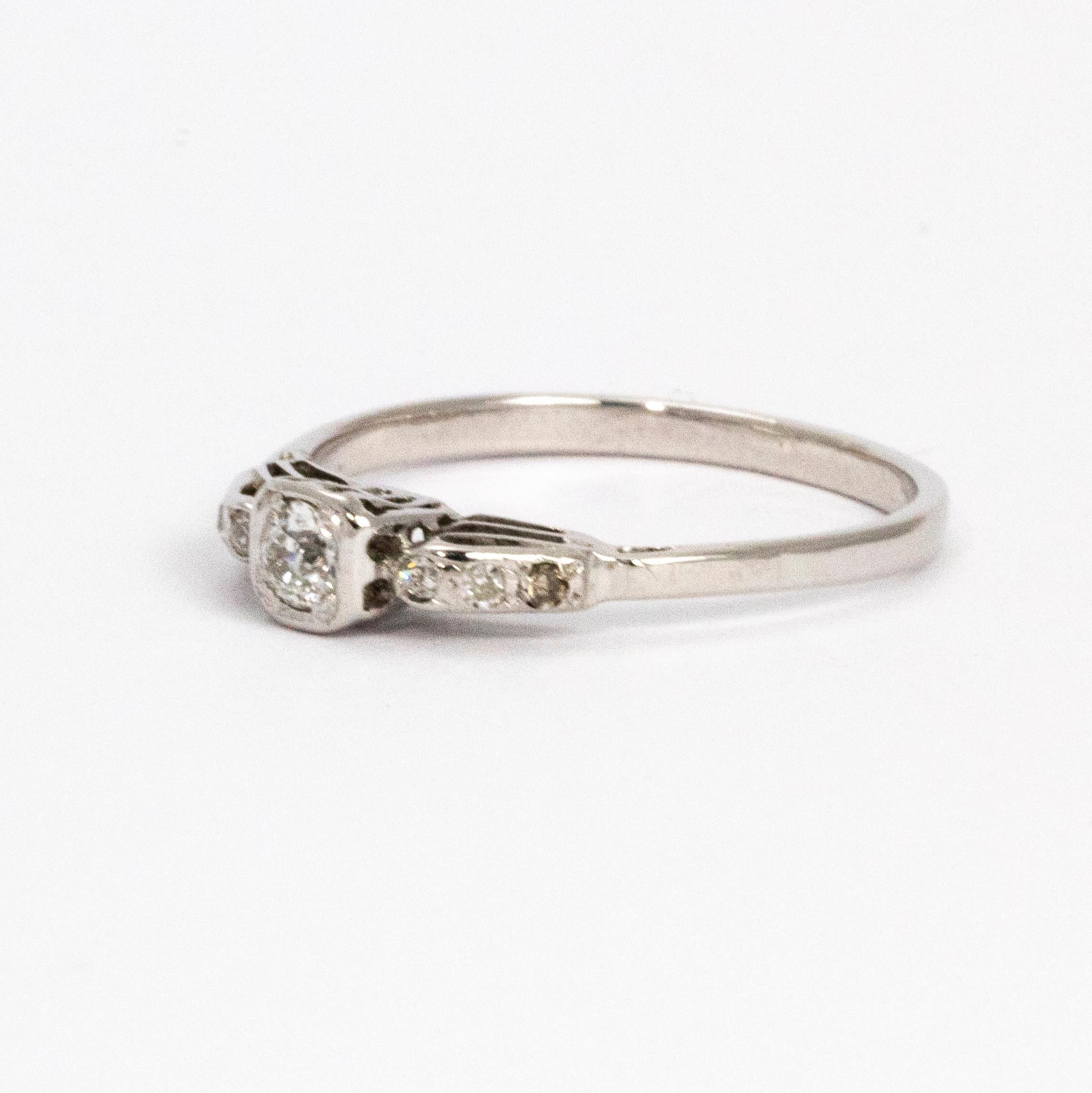 Delicately beautiful Edwardian platinum ring set with old cut diamonds.

Ring Size: N or 6 3/4