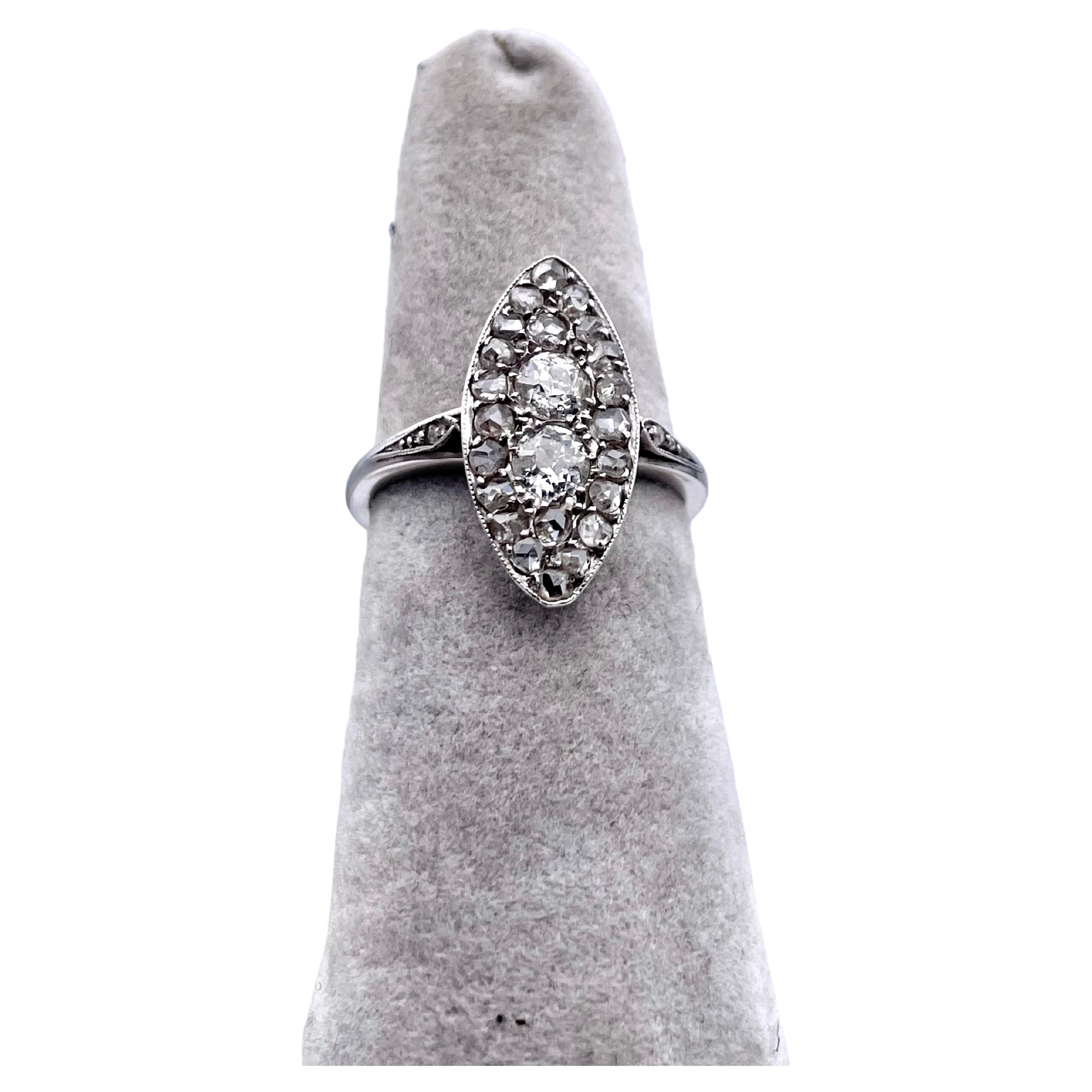 Lovely long tapered marquis-cut ring.  Approximately  carats of rose-cut diamonds. Tapered rose diamonds are set on the shoulders.  The ring is set in platinum. Size 5 1/2 and can be custom-sized.  A lovely distinctive look; an allover soft shimmer.