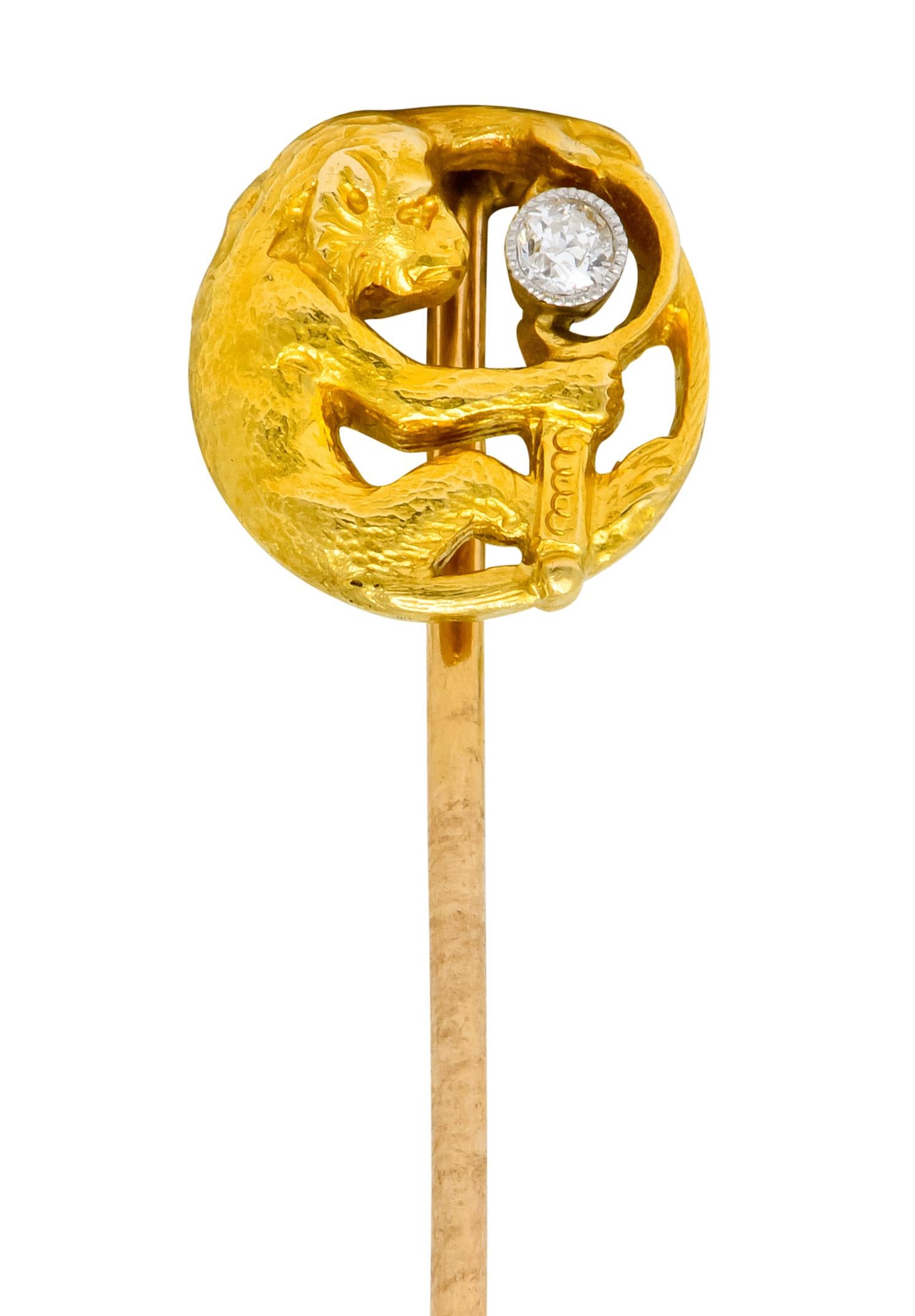 Circular stickpin depicting a monkey holding a mirror with finely textured fur

Mirror accented by old European cut diamond, bezel set in milgrain platinum, weighing approximately 0.06 carat; eye-clean and white

Tested as platinum-topped 18 karat