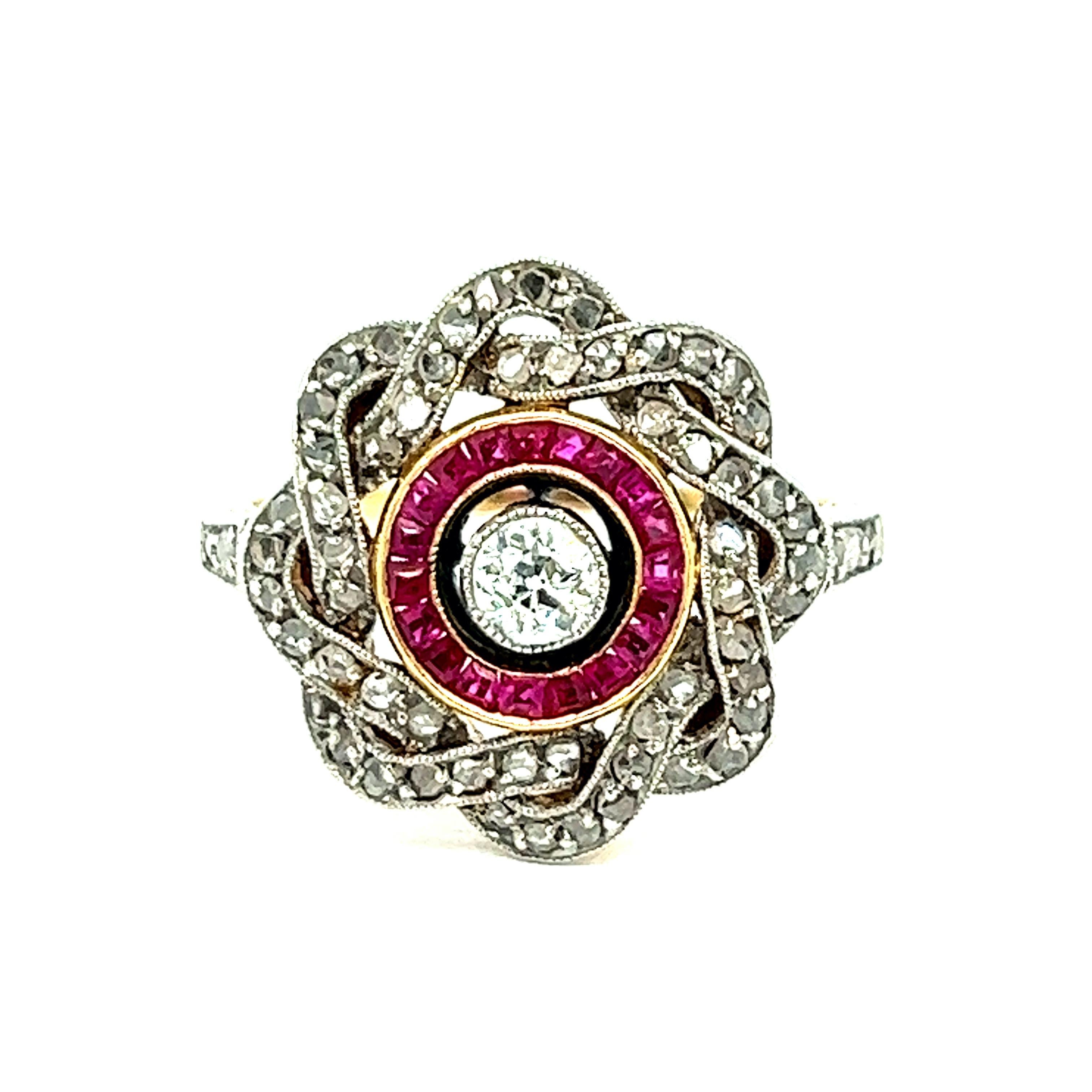 Edwardian diamond ruby platinum ring

Old European-cut center stone diamond of 0.25 carat, rose-cut diamonds, and square-cut rubies; 14 karat yellow gold and platinum

Size: 5.75 US; top width 0.75 inch, length 0.63 inch
Total weight: 4.6 grams