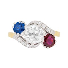 Edwardian Diamond, Sapphire and Ruby Three-Stone Twist Ring, circa 1910