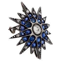 Edwardian diamond sapphire silver and 10k yellow gold star brooch
