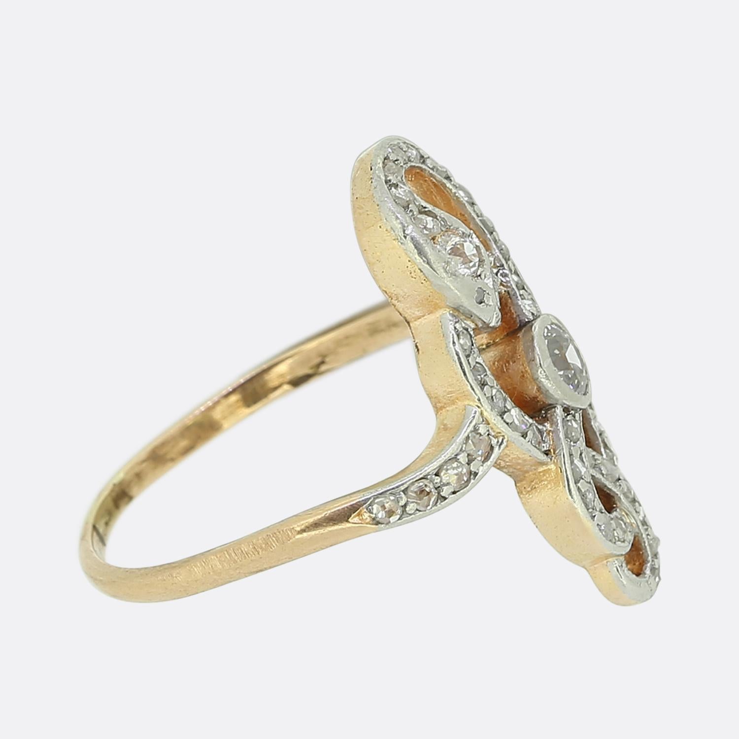 Here we have an excellently crafted diamond snake ring dating back to the Edwardian period. A single round faceted old cut diamond sits rub-over set at the centre of an open face amidst the swirling serpent design. The snake itself has been set with