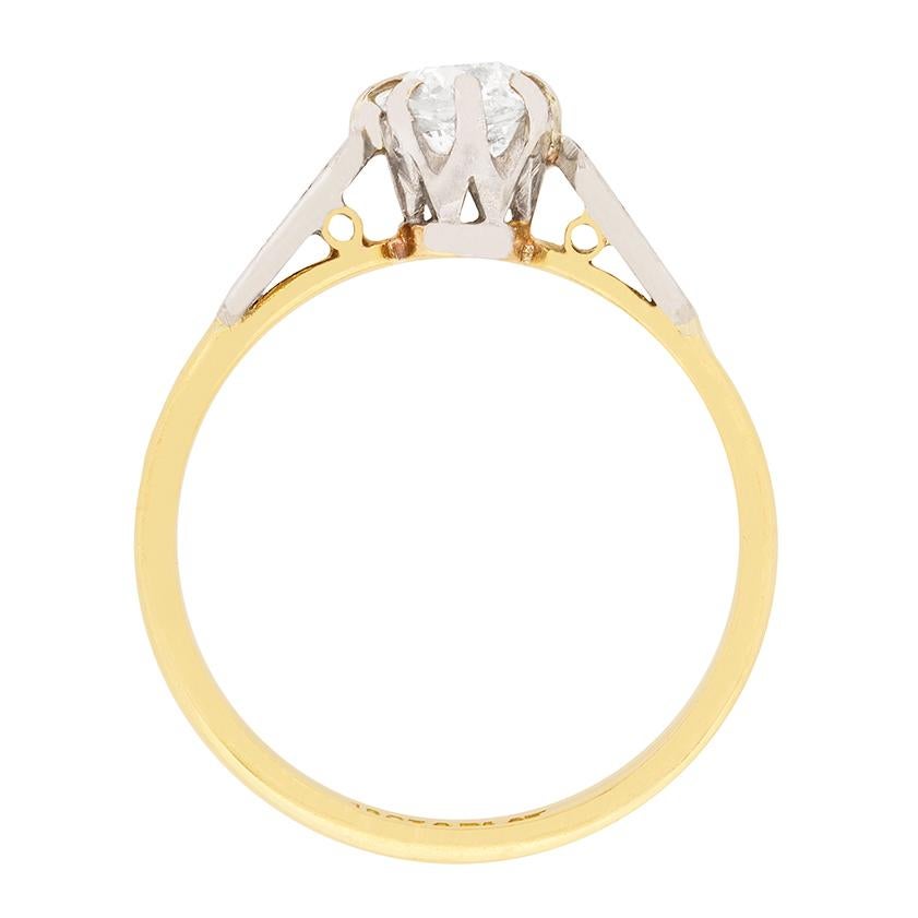 Dating to the Edwardian era, this solitaire features an old cushion cut as the centre of attention. It weighs 0.56 carat and has been estimated as H in colour and SI1 in clarity. The claw setting and patterned shoulders are made from platinum,