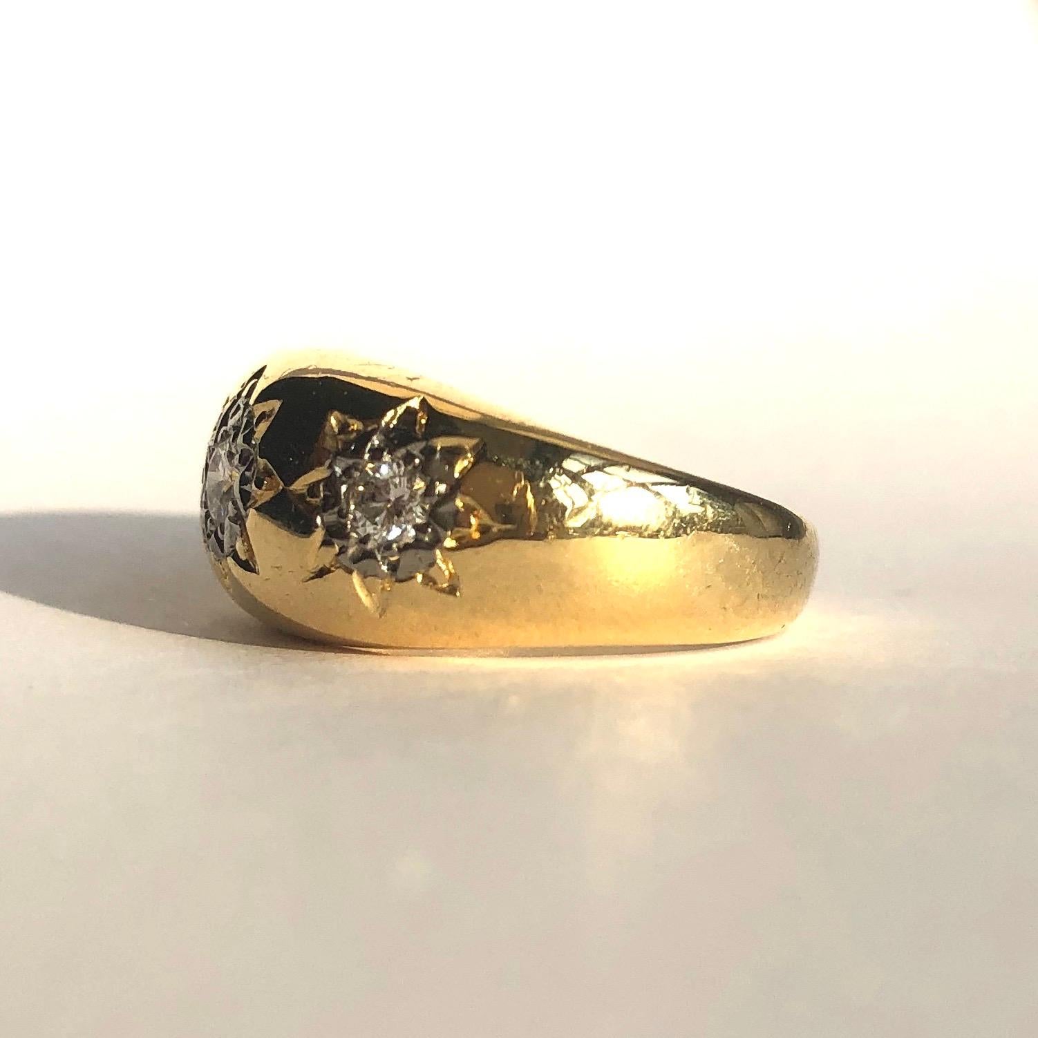 This gold band is gorgeously chunky and wide. The 18ct gold has three stars etched into it and then at the centre is another platinum star setting holding the diamonds. The diamonds total 45pts and are bright and sparkly. 

Ring Size: O or 7
Band
