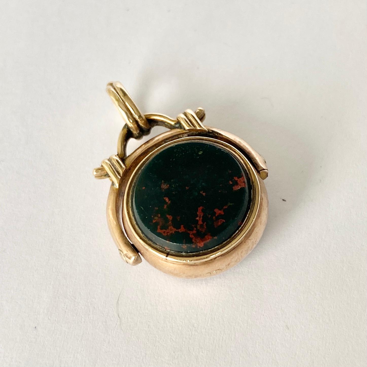 This swivel fob can be used as the perfect pendant. The two stones that are in this fob are held in place with 9ct gold. These stones are deep rich carnelian and bloodstone with gorgeous red flecks running through it. 

Stone Diameter: 14mm

Weight: