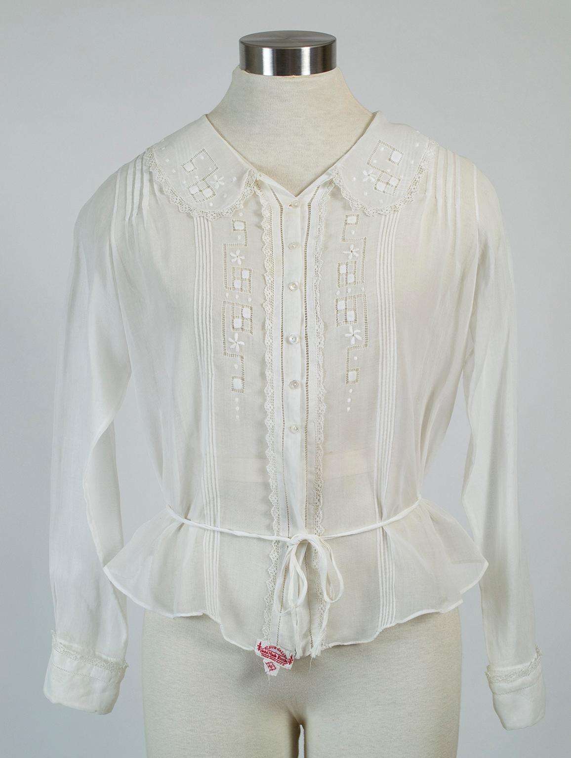 As delicate as a spider web (and almost as sheer), this blouse is an alluring exercise in concealing and revealing: though every inch of skin is covered, its gossamer lightness allows you to see right through it. Victorian-era details like pintucks,