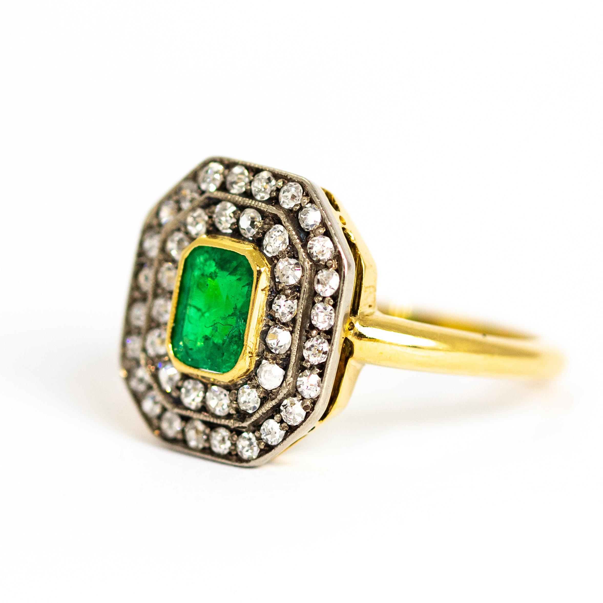 This stunning ring holds a wonderful bright emerald cut Emerald in the centre of two halos of sparkling old european cut Diamonds. The emerald is set in 18ct gold which makes the green really pop and the diamonds are set in platinum. 

Ring Size: R