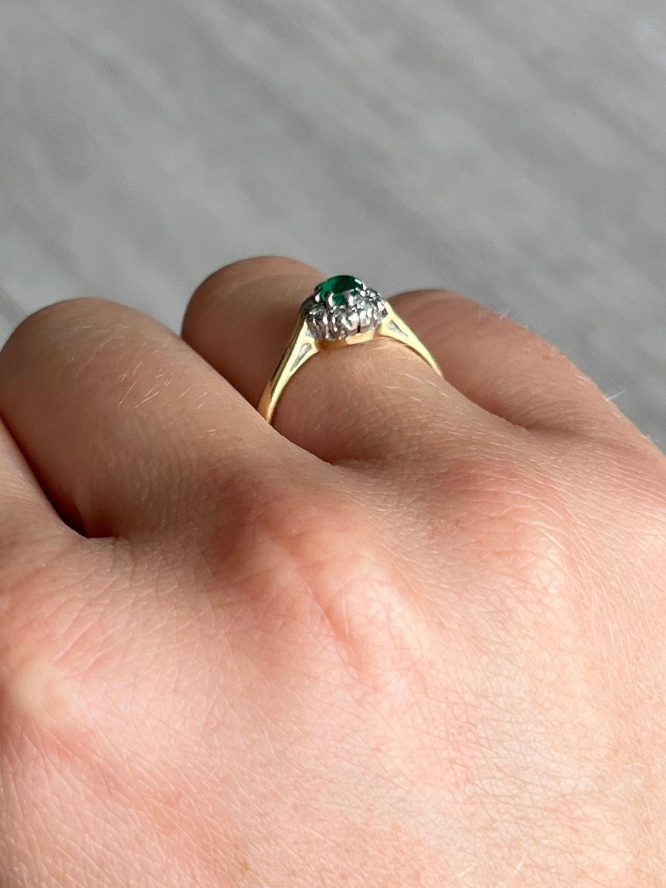 This stunning cluster boasts a 25pt emerald at the centre of it. Surrounding the beautiful green stone are diamonds totalling 16pts. All modelled in 18carat gold and stones set in platinum.

Ring Size: K or 5 1/4
Cluster Diameter: 7mm

Weight: 2.5g