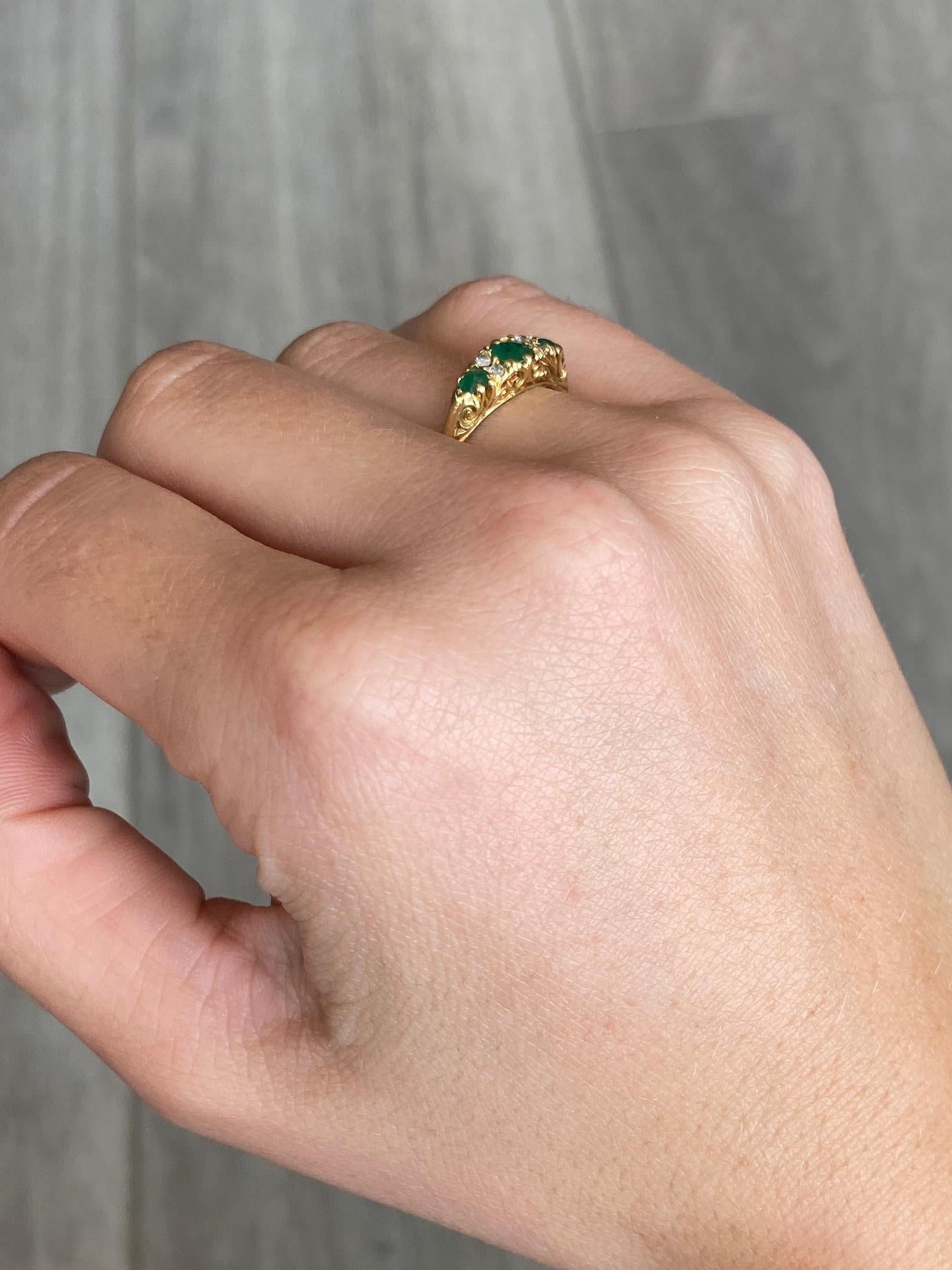 This gorgeous three stone holds three emeralds which total 50pts and in between them sit two pairs of diamonds totalling 10pts. The ring is modelled in 18ct.

Size: J or 4 3/4
Width: 5mm

Weight: 2.8g