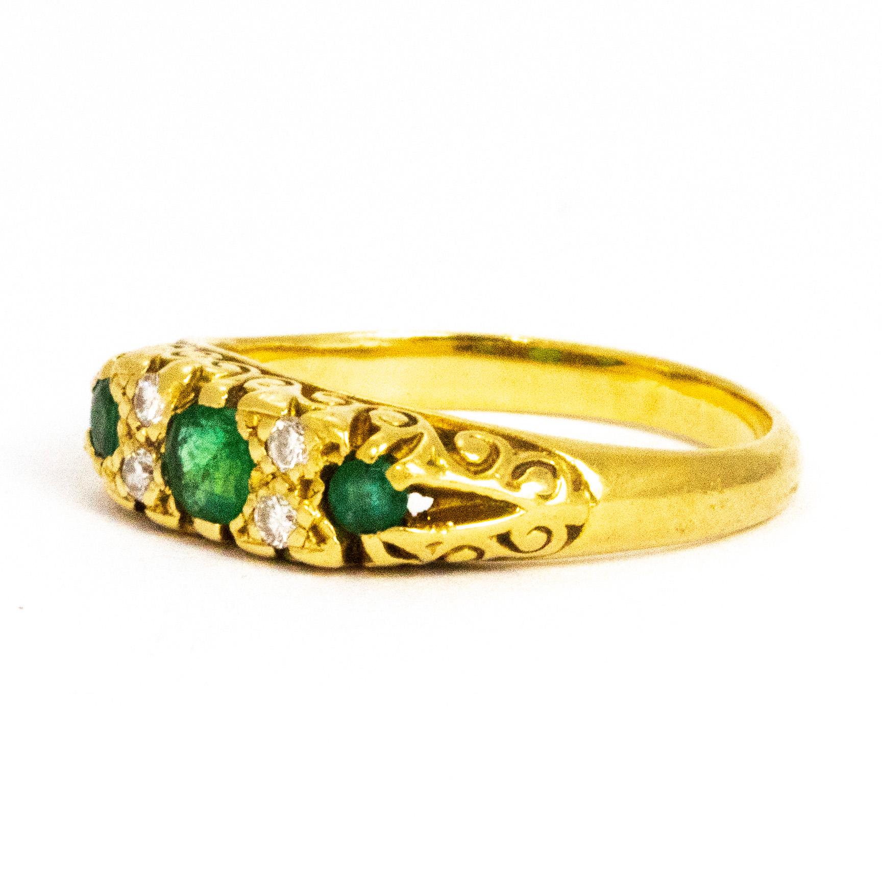This three stone emerald ring has a 25pt centre stone and the smaller emeralds on the outside measure 7pts each. In between the deep green emeralds sit two pairs of sparkling diamonds measuring 3pts each. The perfect stack ring or just as striking