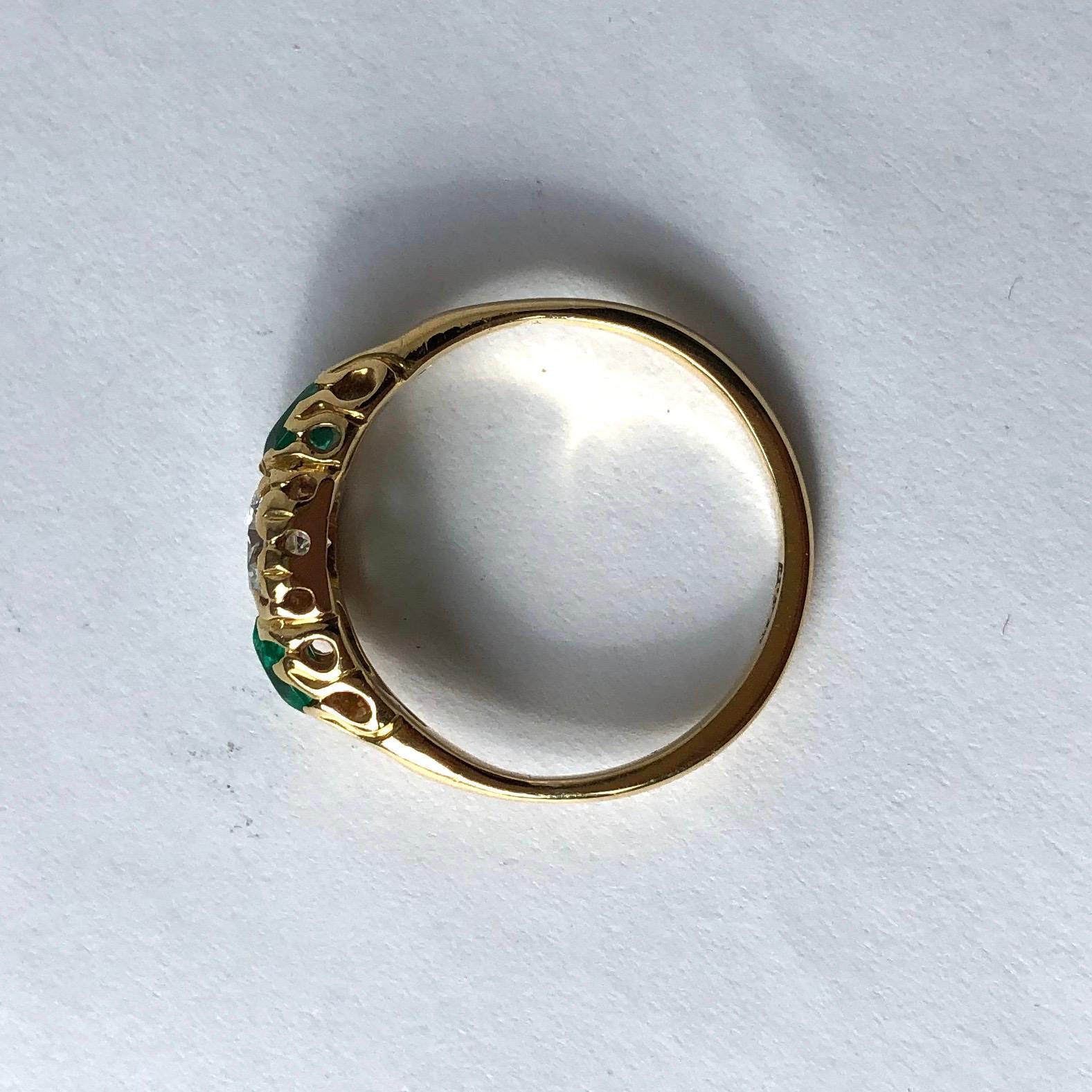 Edwardian Emerald and Diamond 18 Carat Gold Three-Stone Ring In Good Condition For Sale In Chipping Campden, GB