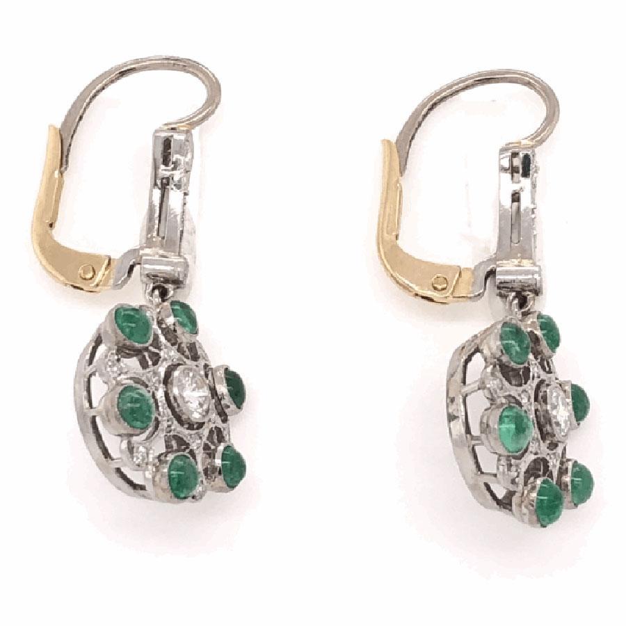 Beautiful, Elegant & finely detailed  Cluster Dangle Earrings set with Green Emerald Gemstones, approx. total weight of the 2 Emeralds 1.80 Carats and enhanced with Diamonds, approx. total weight 0.66 Carats. Hand crafted in Platinum; earrings