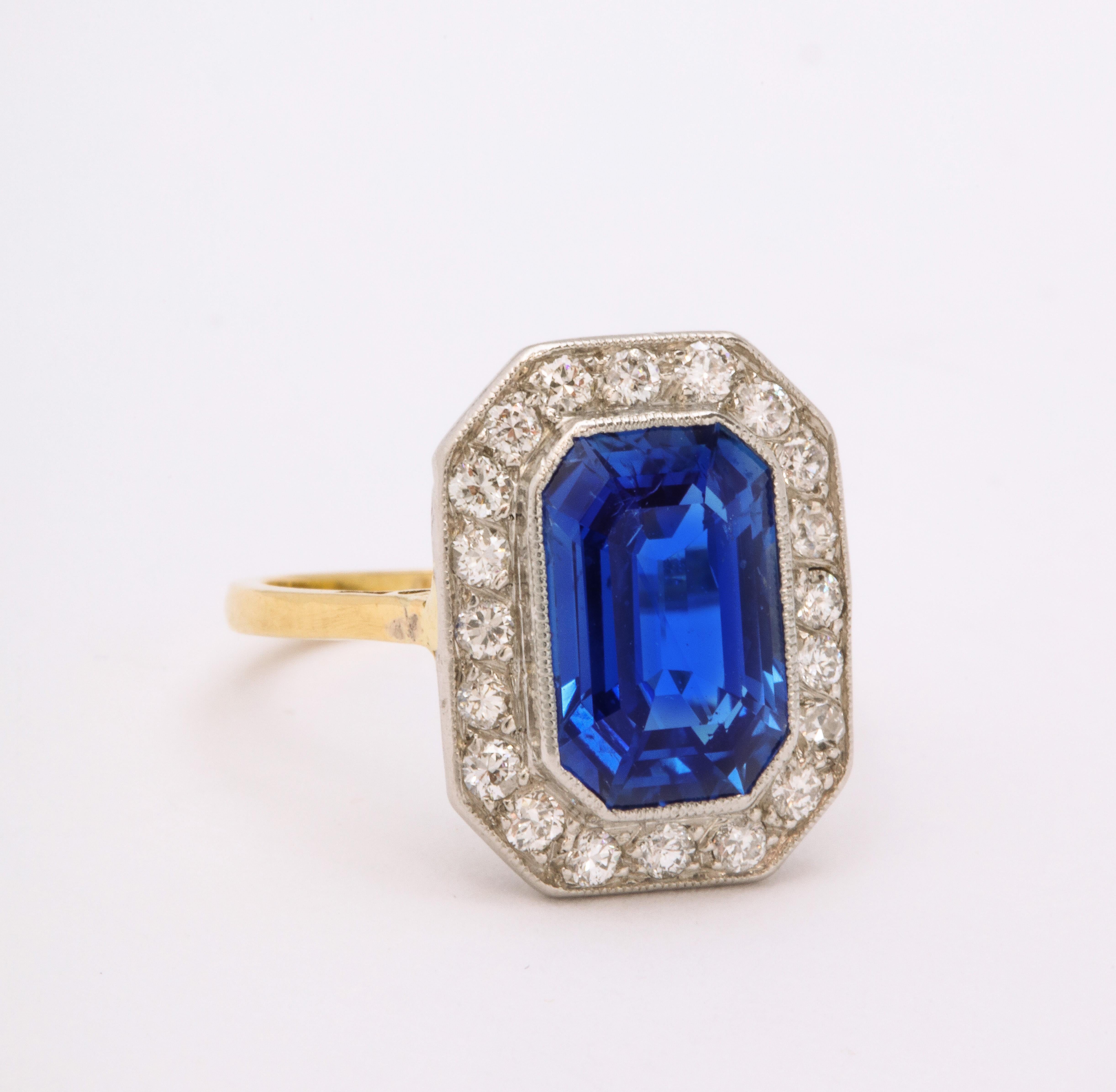 Edwardian Emerald Cut Burmese Sapphire Diamond Yellow and White Gold Ring. Size 4 1/2,easily sized by your jeweler or us

Materials:
18K yellow & white gold
2.5 dwt
Unmarked but tested

Stones:
Burmese Sapphire untreated @ 9.0 carats tw
fine white