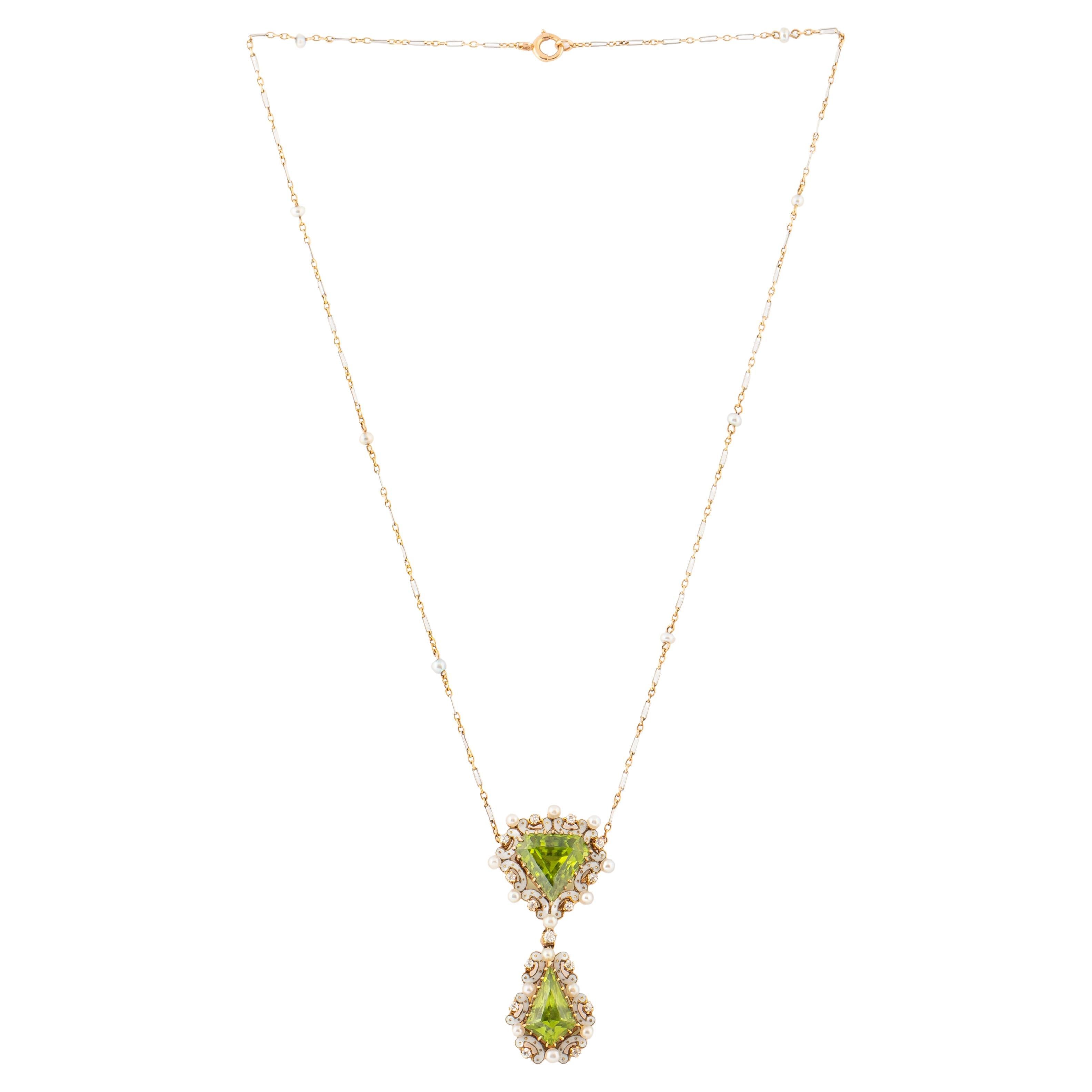 A beautiful English Edwardian Necklace, the center set with two kite-shaped-an innovative cut at that time- peridots of vibrant apple green color, each within white piqué enamel borders enhanced with lustrious natural seed pearls and bright diamond
