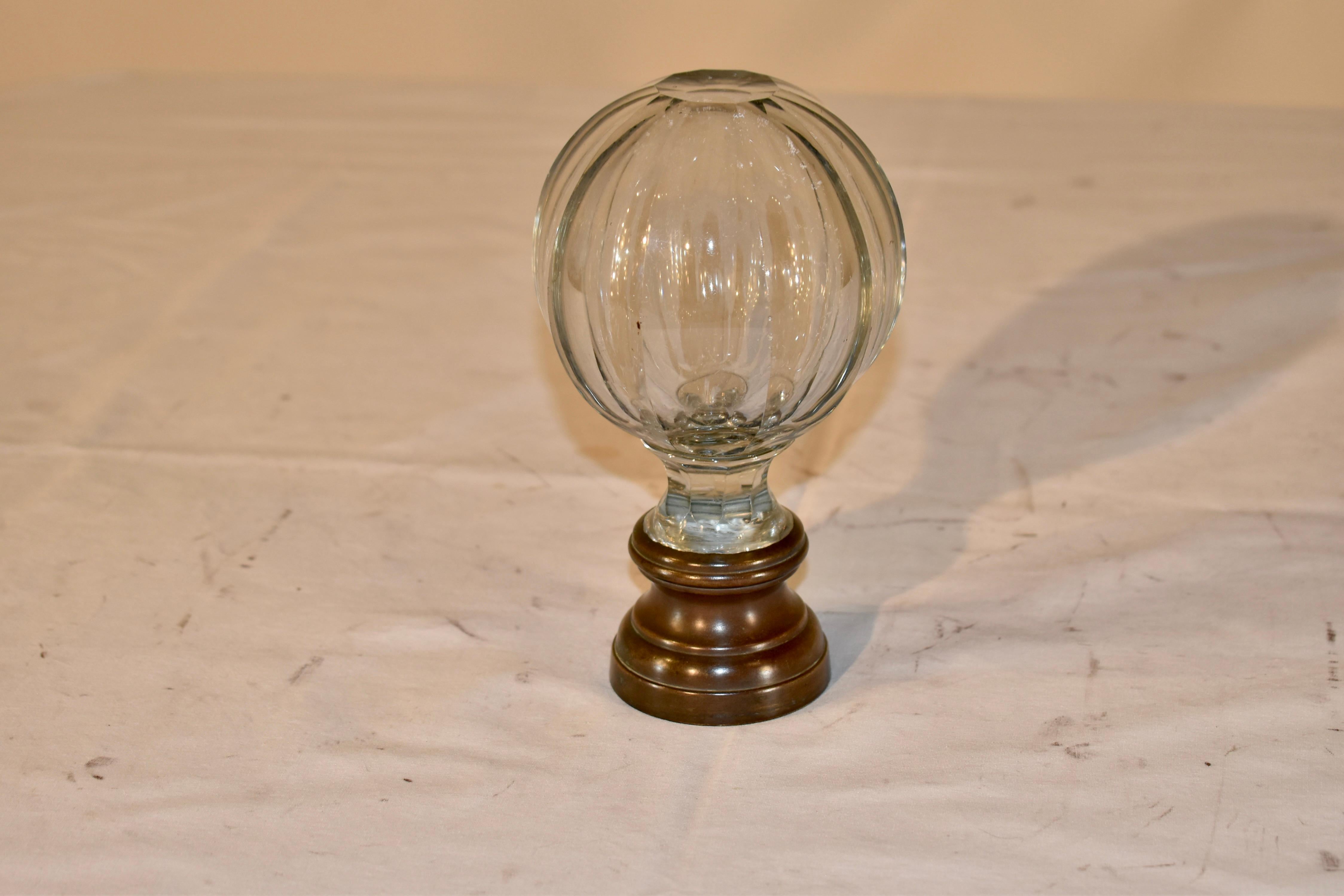 Edwardian cut crystal faceted newel post finial , supported on its original cast bronze base.  This would have been on the main post of the staircase in a fine home, and now, would look wonderful on a desk, in a shelf display, or back mounted as a