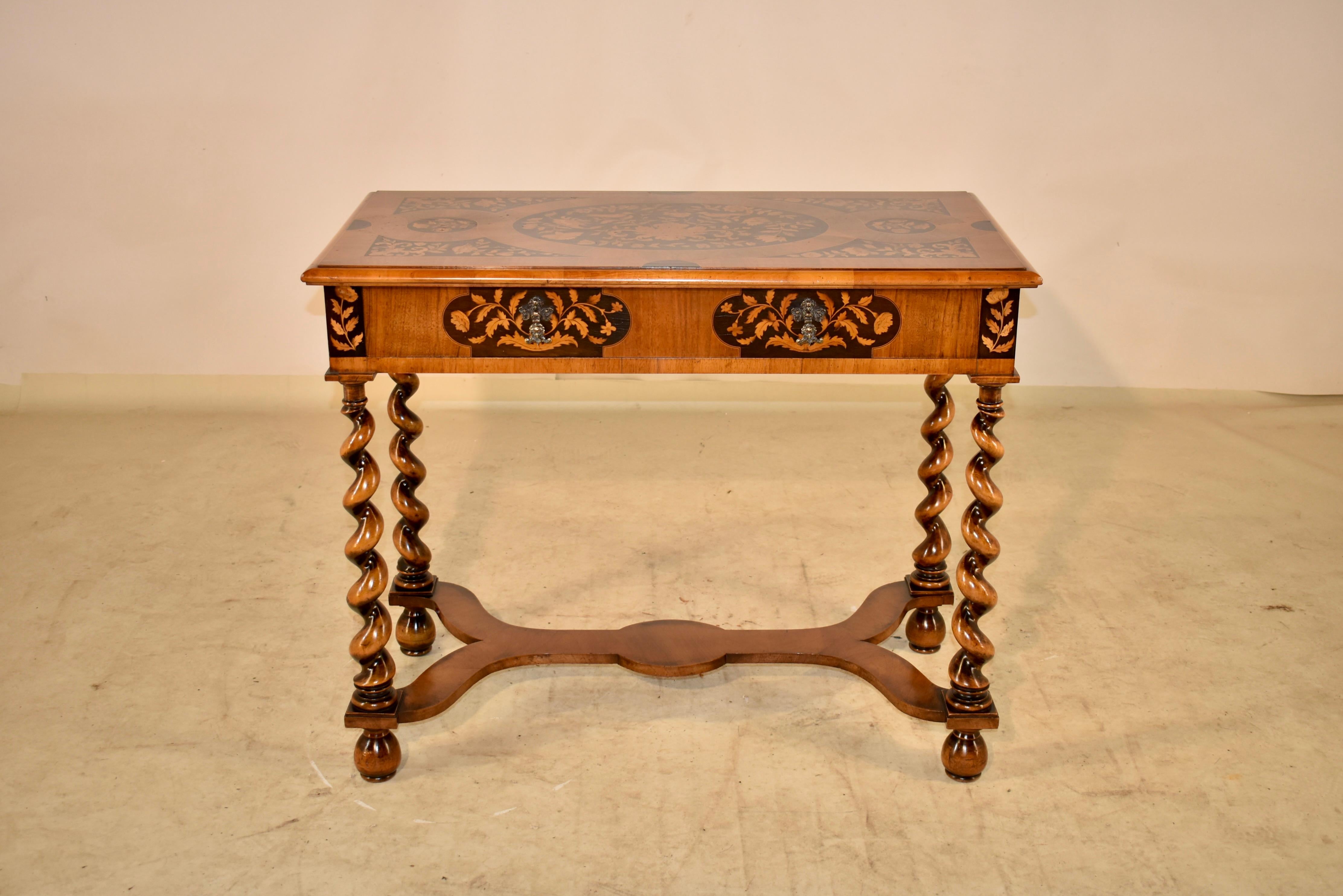 William and Mary style burl walnut table with exquisite marquetry detailing, circa 1900.  The top is banded and has a beveled edge surrounding a profuse floral and bird design marquetry detailed top, following down to a single drawer in the front