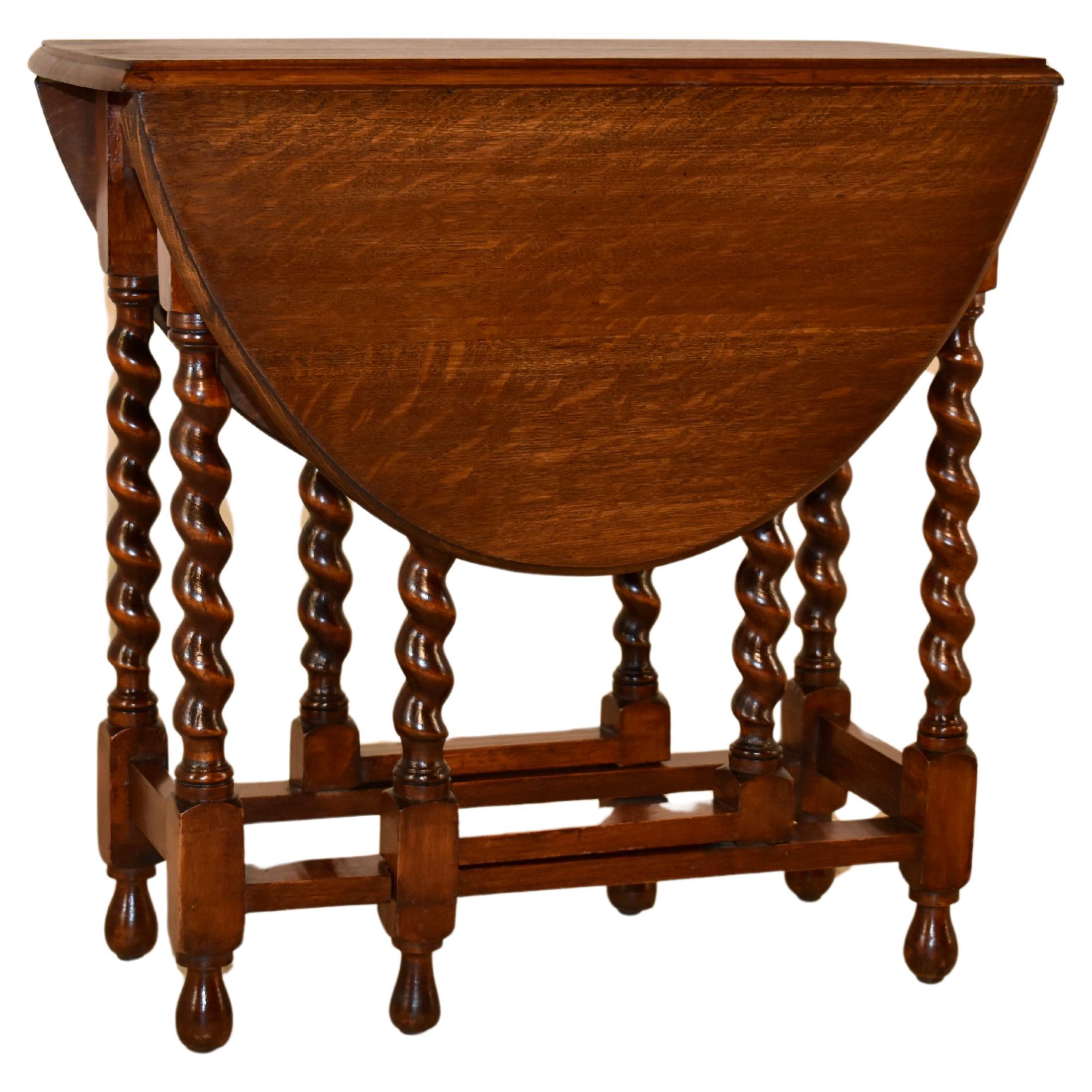 Table anglaise édouardienne à pieds de porte en chêne, vers 1900 en vente