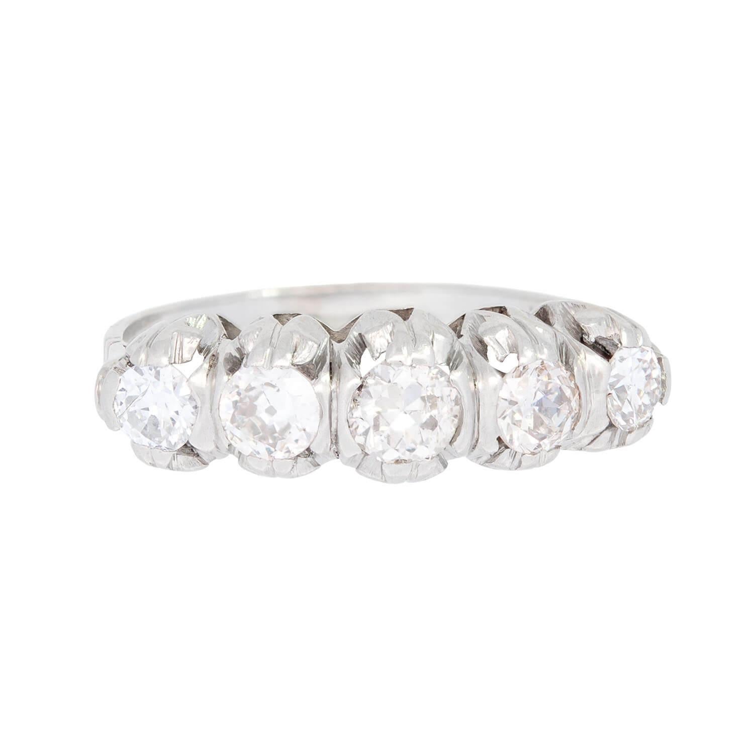 This English 5-stone diamond ring from the Edwardian (ca1910) era is simply stunning! The wonderful, feminine design has a platinum mounting holding a sparkling line of diamonds. The five old European cut diamonds weigh approximately 1.10ctw