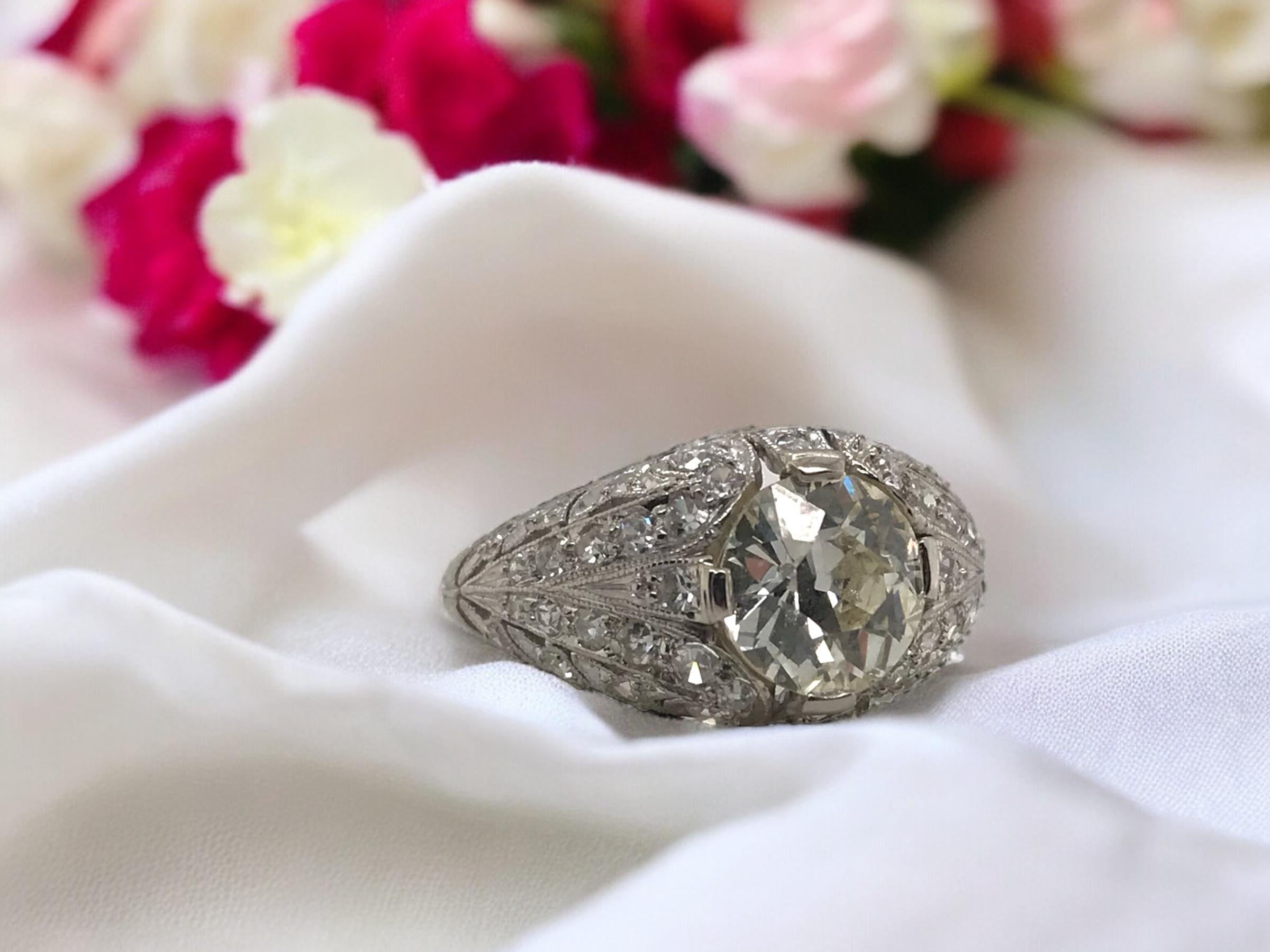 This vintage beauty is as detailed as they come!
Magnificent filigree combined with engraving all the way down the ring

Ring Details
Material: Platinum
Era: Edwardian 1900 - 1920
Width: 10.6mm
Height: 6.7mm
Weight: 5.8 Grams
Finger Size: 5