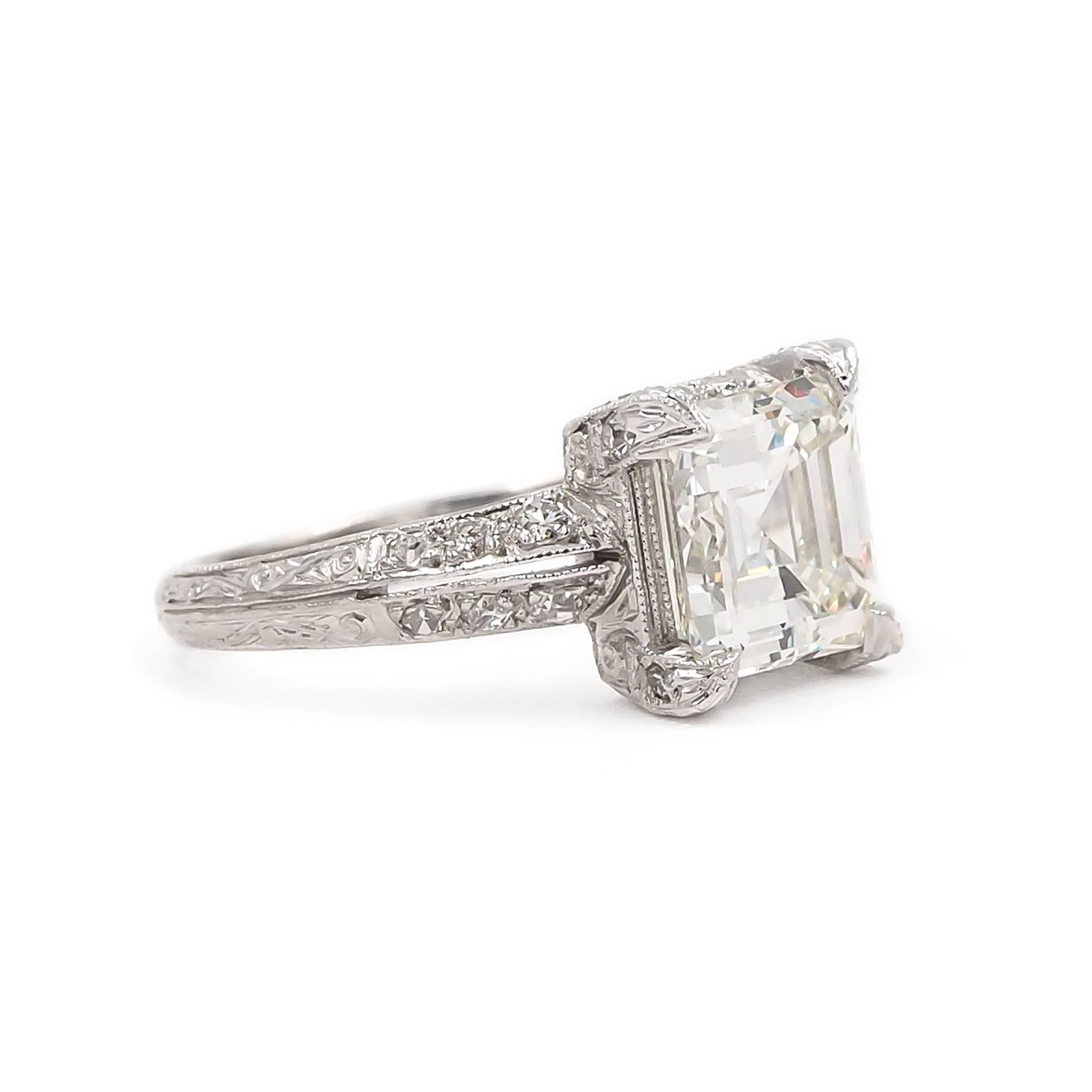 
Beautiful example of Edwardian craftsmanship. Composed of platinum with a pierced open work & fiiigree design. Featuring a center stone 2.04 Carat Square Emerald Cut Diamond. Accented with 12 Pave Set Round Cut diamonds weighing 0.26 Ct. in total.