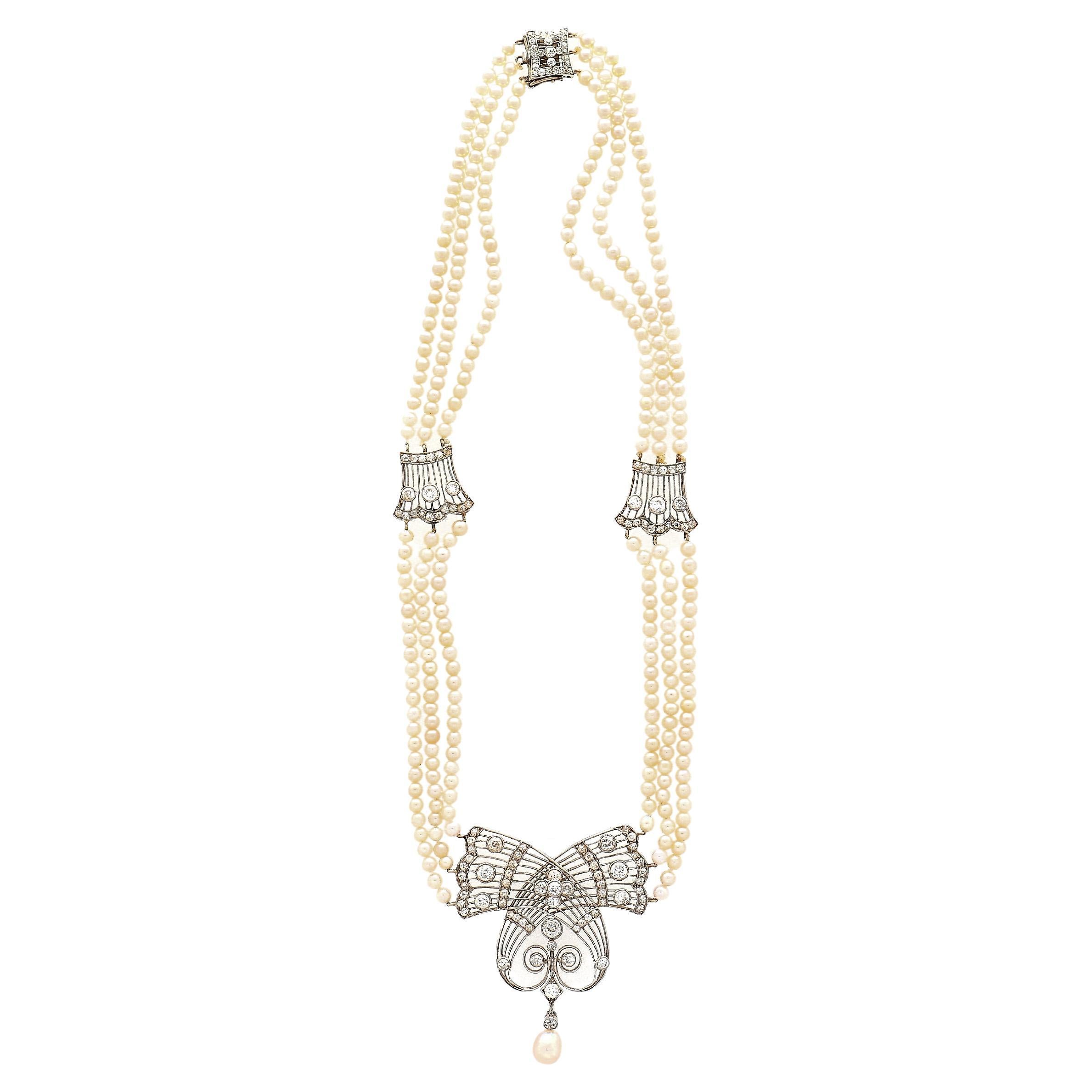 Original antique Edwardian era GIA certified saltwater pearl and diamond necklace in a platinum setting. The Pearls are all natural, untreated, and feature excellent luster. Fitted with a box closure and 14-inch length. This necklace is a piece of