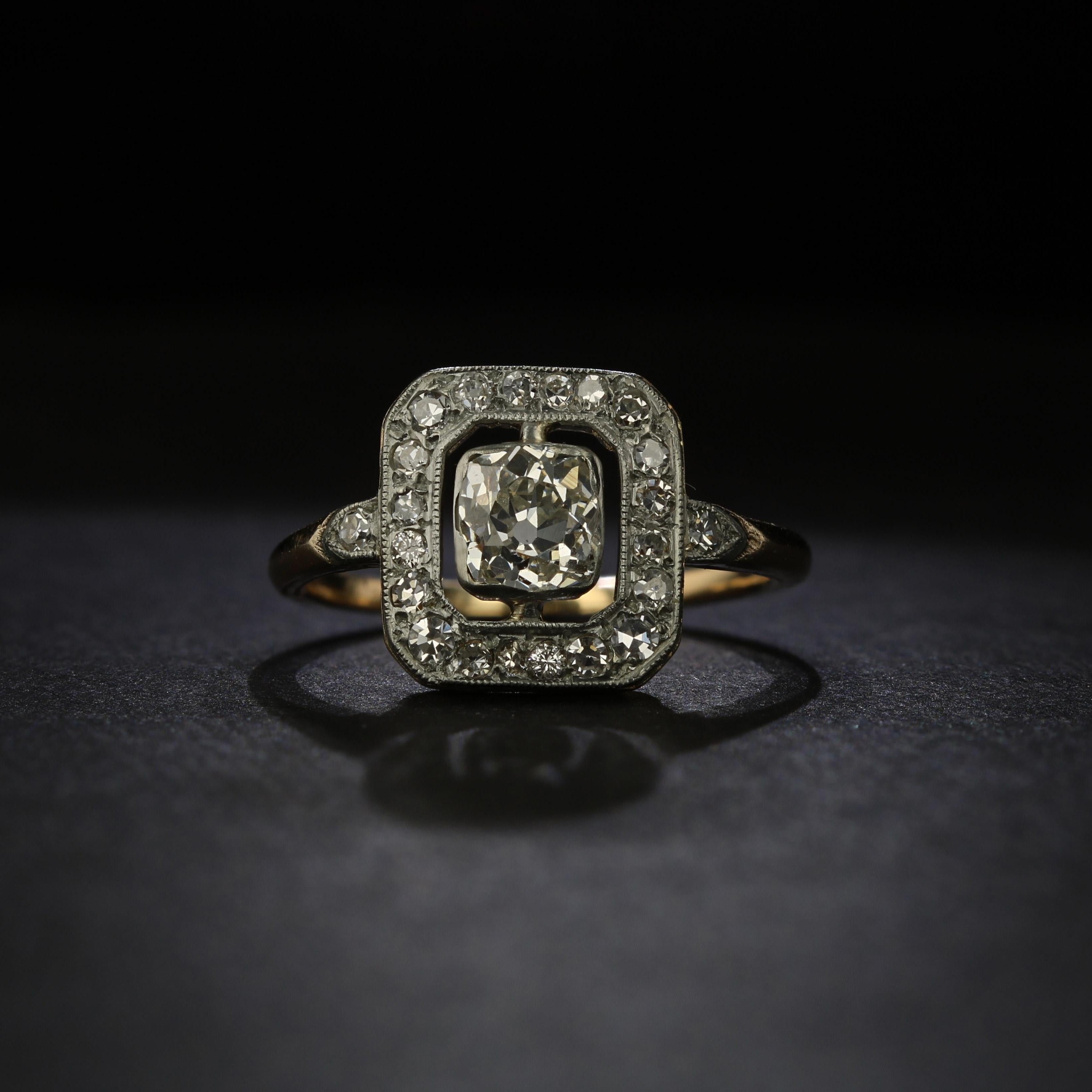 A striking piece from the Edwardian era, or the turn of the 20th century, this ring features a stunning 0.80 carat old mine cut diamond set preciously in a platinum bezel. Surrounding the diamond is an open and airy space that lets the beauty of the