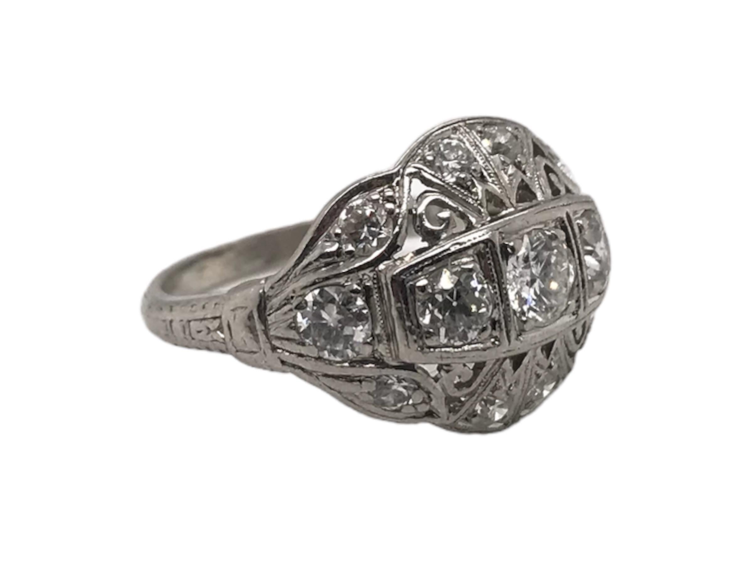 This lovely ring is absolutely perfect for everyday wear!
This beauty features a timeless shield design & is accented by 13 Old European Cut diamonds.
The design sit nice and low to the finger and is has exceptional scroll style filigree