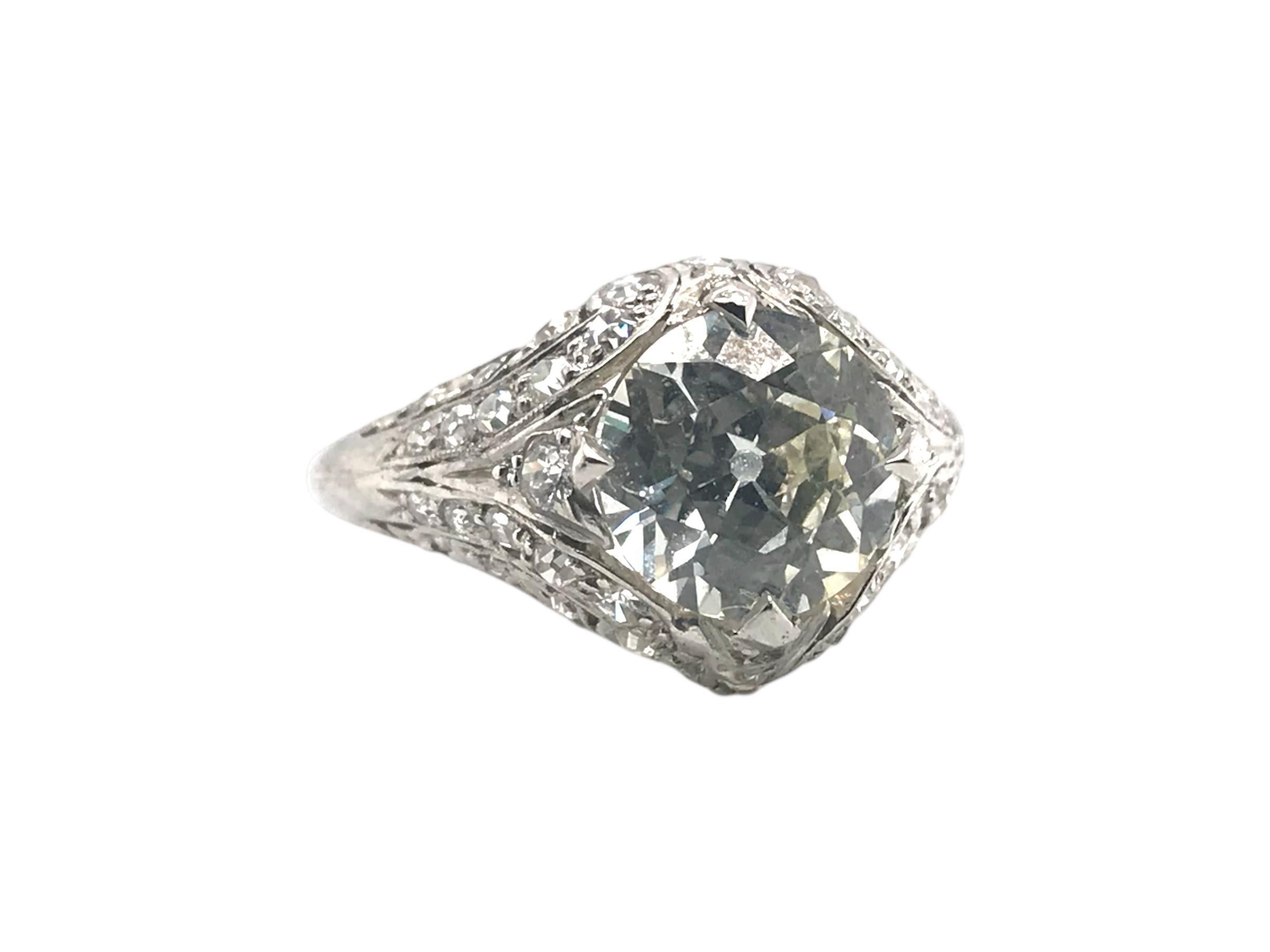 We love every detail about this vintage beauty!

Diamond Details:
Cut: Old European
WeightL 2.02 Carat
Color: M
Clarity: VS2 
Dimensions: 8.09mm X 8.17mm X 4.44mm 
GIA: 5222905031; Laser Inscribed 
40 - Single Cut Diamonds 1.0mm - 1.4mm
2 - 2.0mm