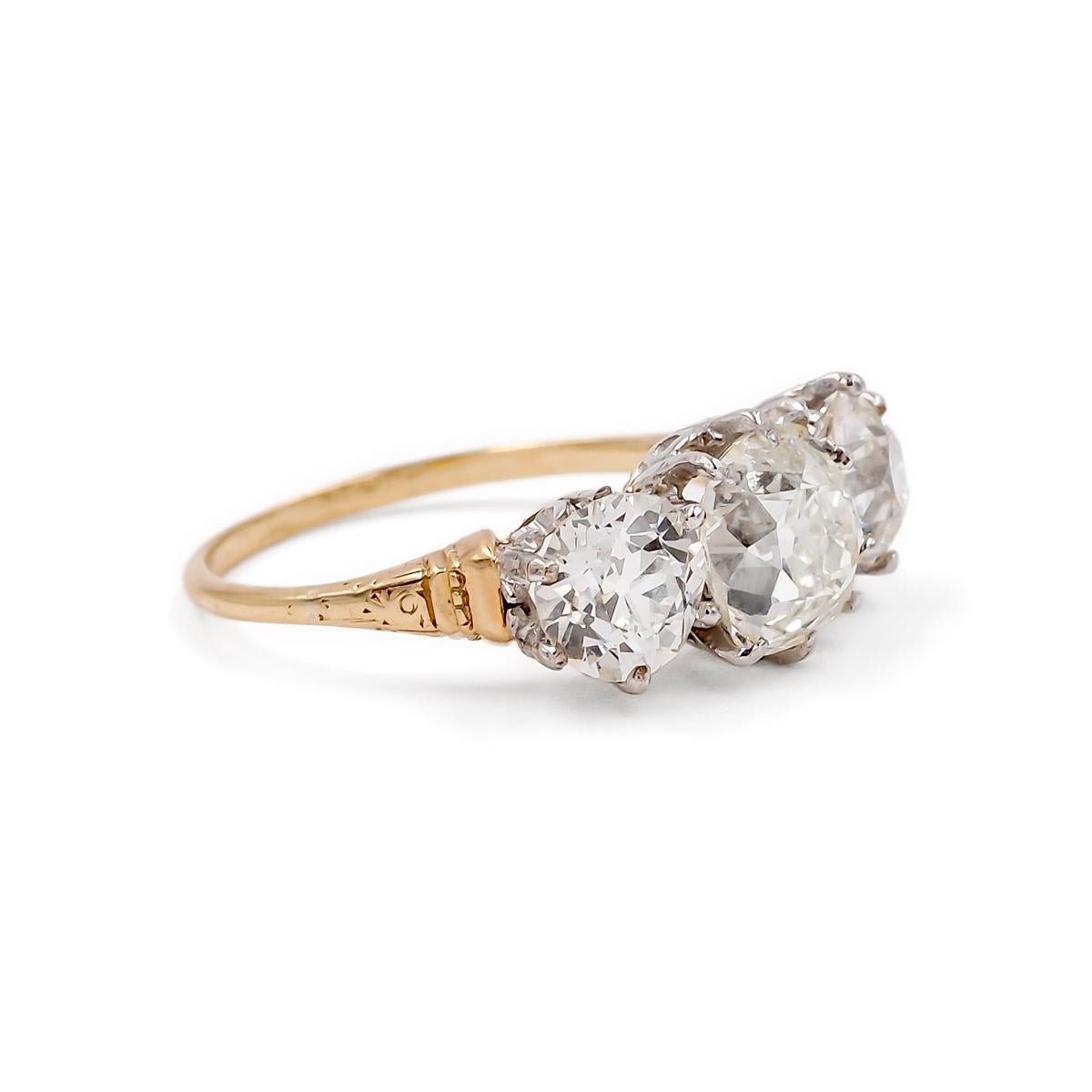 A fine example of Edwardian era craftsmanship. Composed of a platinum top & 14k yellow gold shank with delicate filigree detail. Accompanied by a Professional Gem Sciences Laboratory (P.G.S) Diamond Report stating that the ring features a center