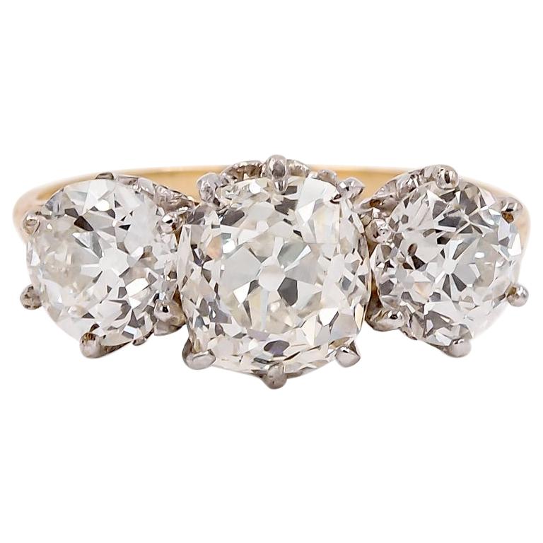 Edwardian Era Platinum and Gold Three-Stone Diamond Ring