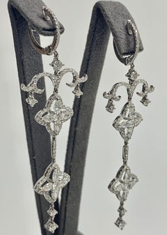 Round Brilliant Cut & Pear Shape Diamond, White Gold Earrings