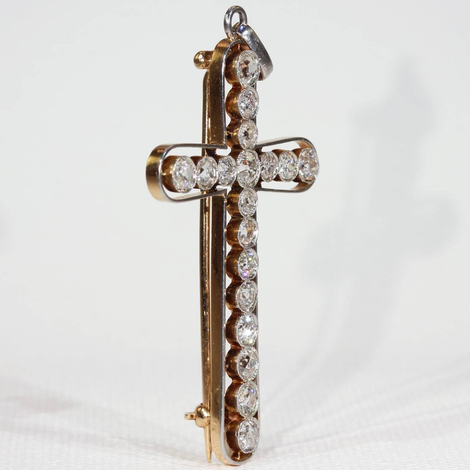 This lovely antique Edwardian diamond cross pendant was handcrafted around 1910. It has a brooch fitting, but we’d be happy to remove it upon request. There are 18 sparkling Old European cut diamonds totaling approximately 2.4 carats. Each stone is
