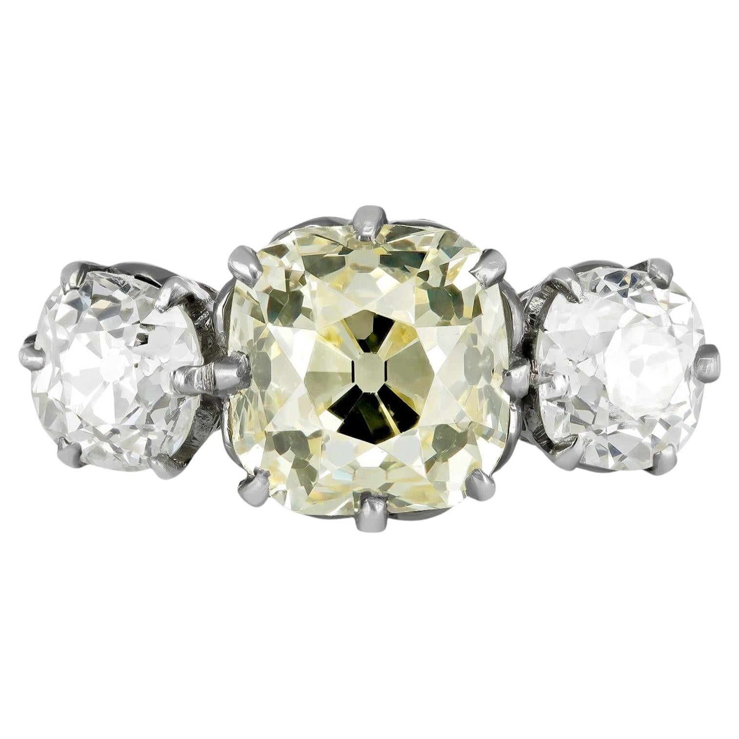 Edwardian 3.16 carat Fancy Light Yellow Diamond Three-Stone Ring, circa 1910