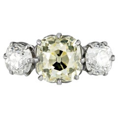 Edwardian 3.16 carat Fancy Light Yellow Diamond Three-Stone Ring, circa 1910