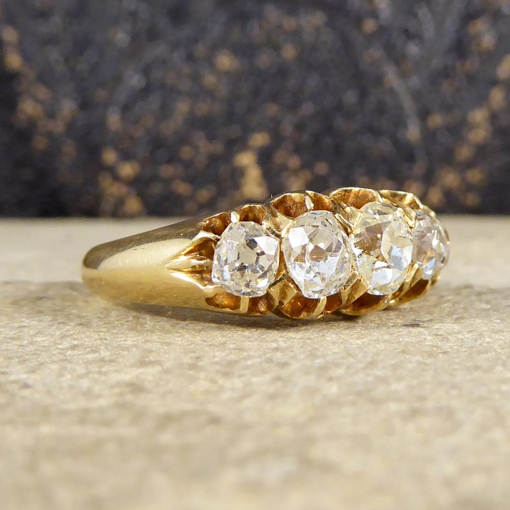 This classic Edwardian ring has been crafted in 18ct Gold. Its beautiful open gallery features five old cut diamonds weighing a total of 1.85ct and sits beautifully on the hand sparkling from all angles! 

Diamond Details:
Cut: Old Cut
Carat: 1.85ct