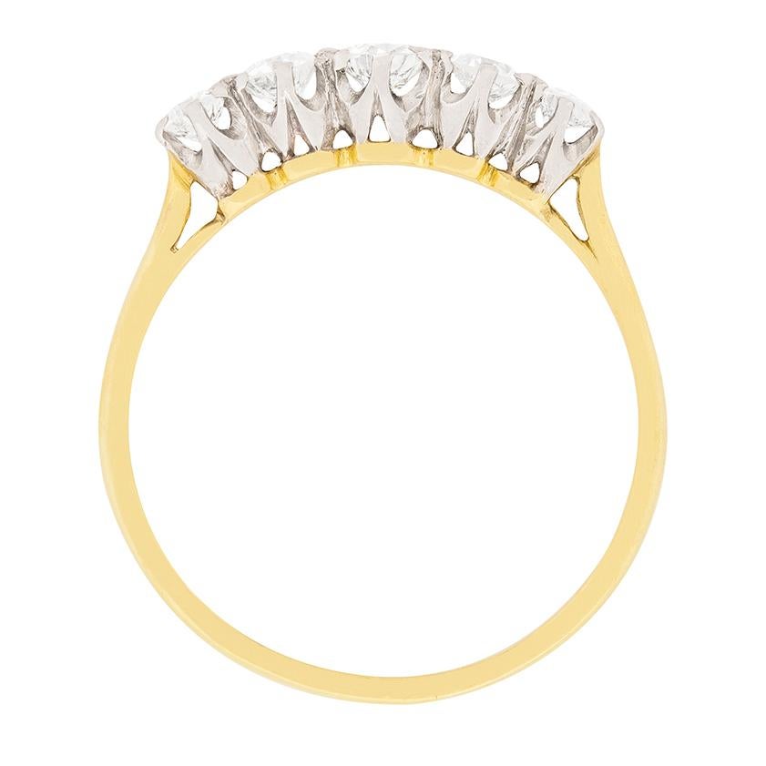 This ring has a combined weight of 0.70 carat. The diamonds are old cut diamonds, hand cut, with the centre weighing 0.20 carat and then graduating out in size. The next two are 0.15 carat each and the two on the ends each weigh 0.10 carat. They are