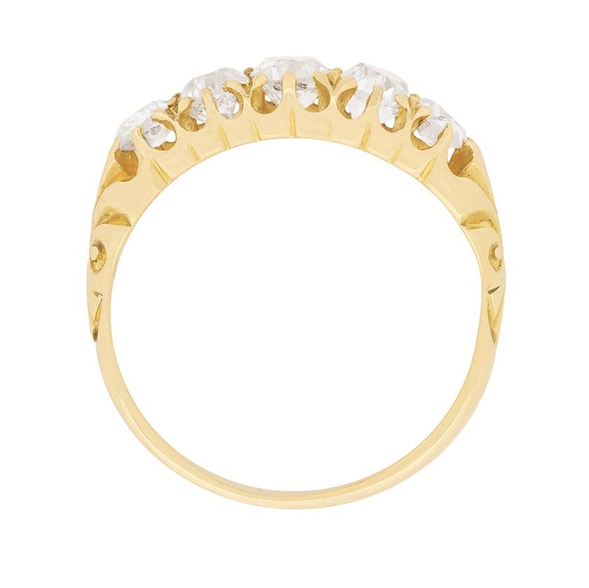 A beautiful five stone engagement ring which shows off the edwardian craftsmanship of the shank and band. The carved shank leads elegantly into the 19 carat yellow gold band.

The diamonds are claw set to highlight their size. The centre stone