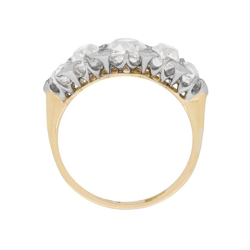 This stunning five stone diamond ring is expertly handcrafted and dates back to the Edwardian era. It has a gorgeous centre stone weighing 1.00 carat, and is then supported by 0.65 carat stones either side, finishing the graduation along the ring