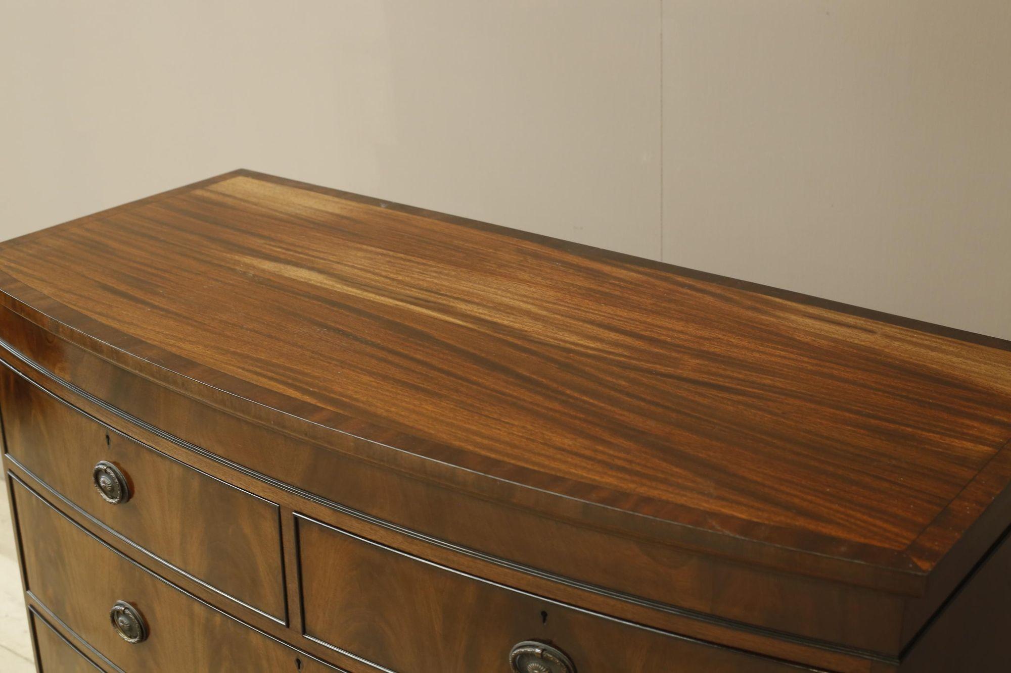 20th Century Edwardian flame mahogany chest of drawers by Marsh, Jones & Cribb