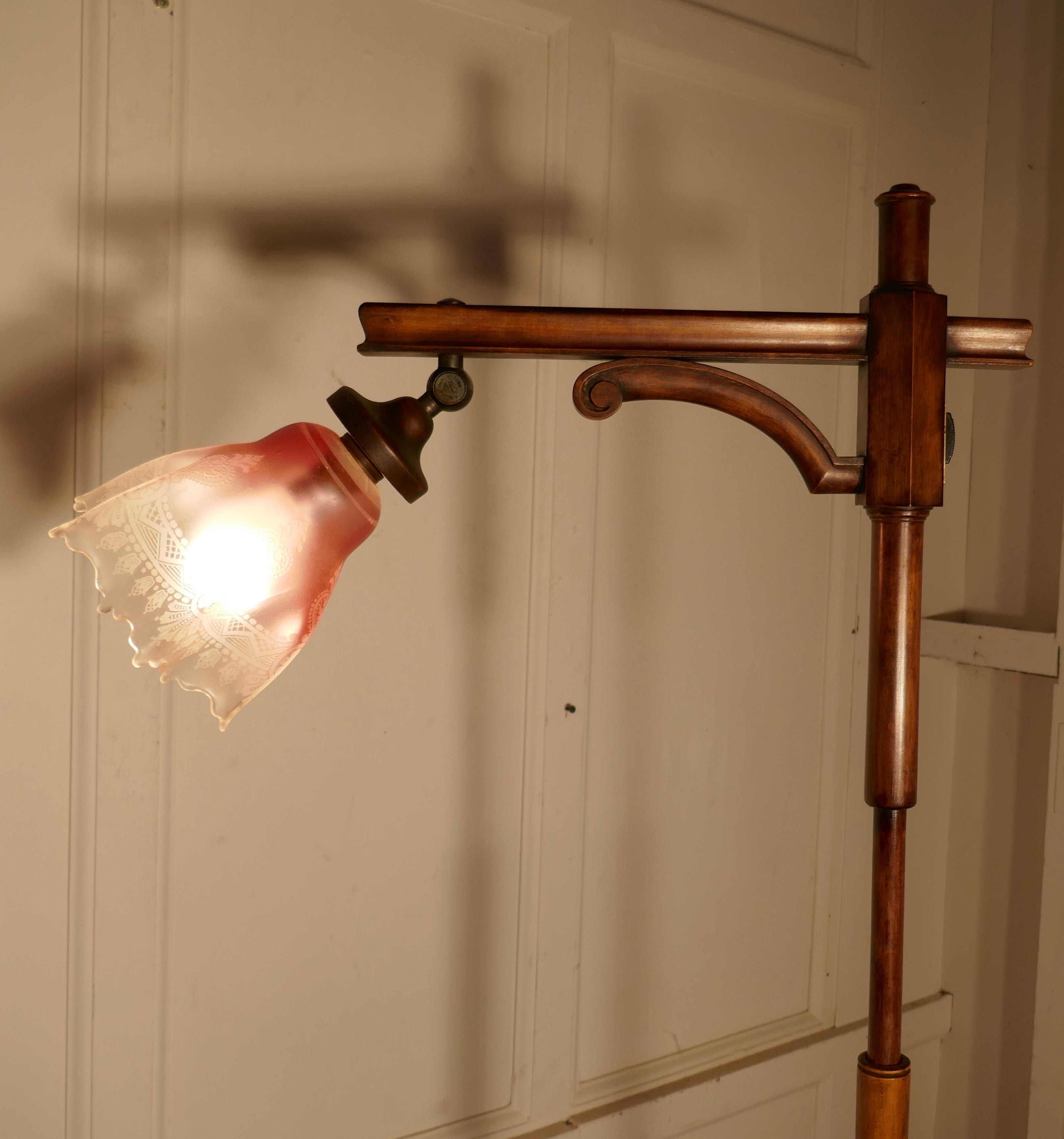 Edwardian floor standing, swivel, angle reading lamp

This charming floor standing reading lamp, can be angled and swivelled for best advantage
The lamp is made in dark stained beech, it has a pink glass etched lampshade
It is in good and