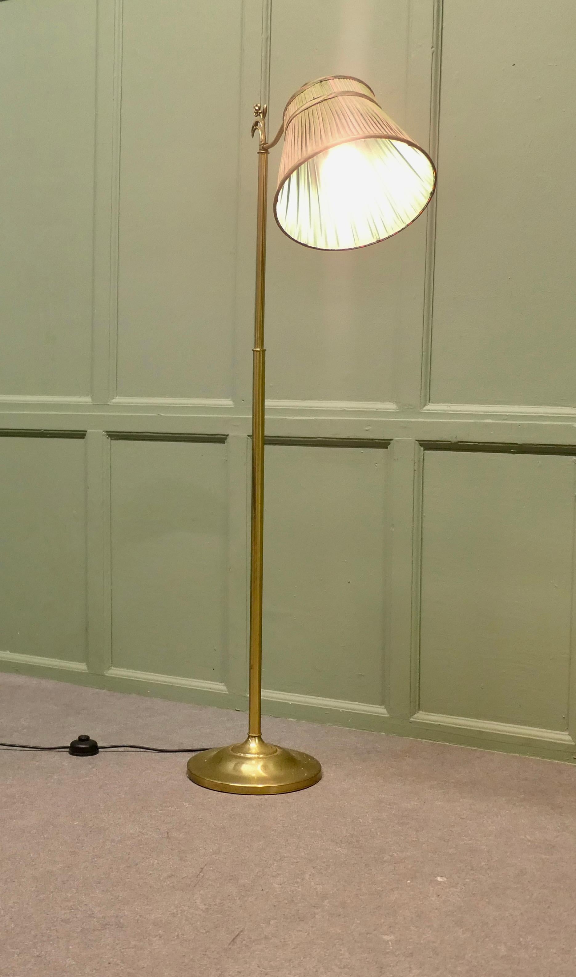 Edwardian Floor Standing, Swivel, Angle Reading Lamp

This charming floor Standing reading lamp, can be angled and swivelled for best advantage
The lamp is made in brass, it has a pink and green lined pleated silk lampshade
It is in good and working
