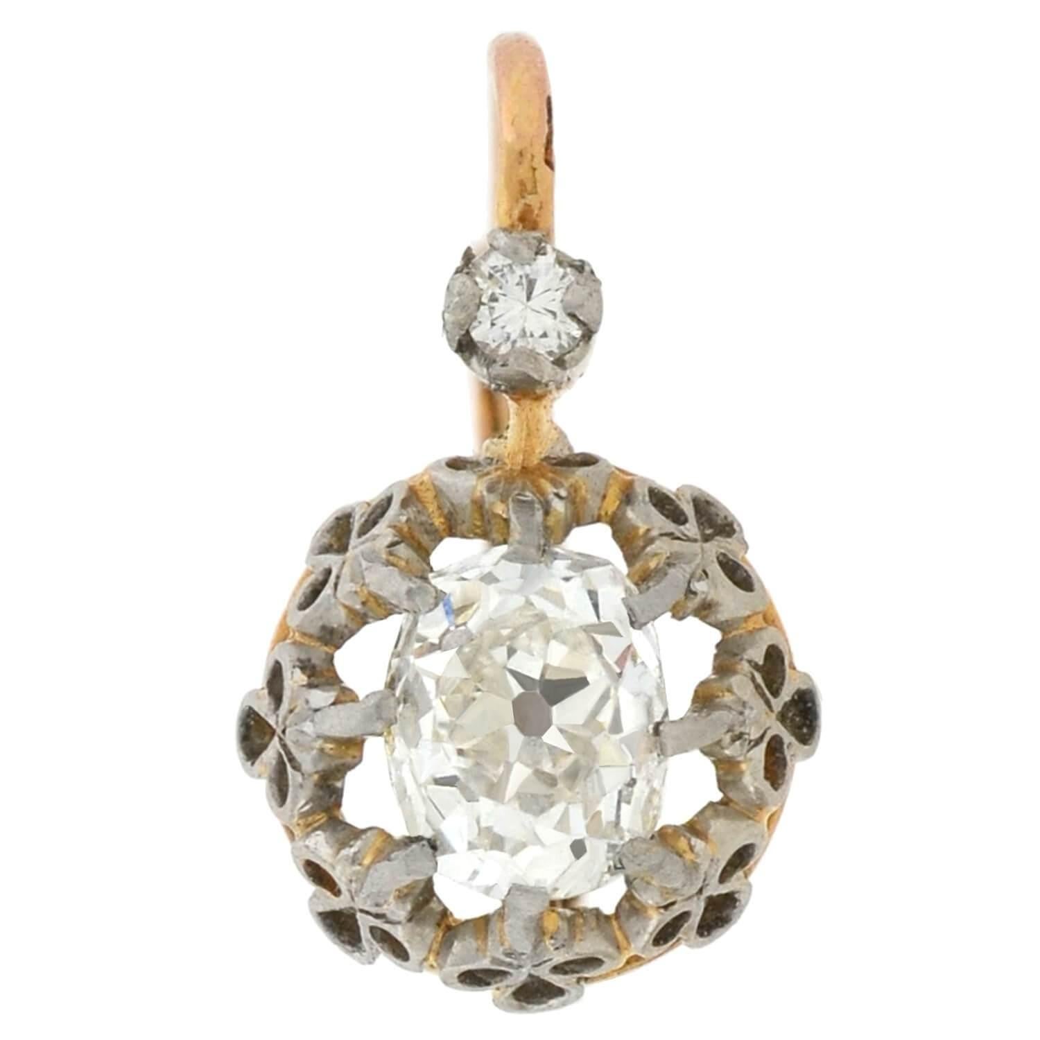 An exquisite pair of mixed metals diamond earrings from the Edwardian (ca1910) era! These lovely French-made earrings are crafted in 18kt yellow gold topped with platinum, and display a simple yet stunning design. The earrings hold a beautiful old