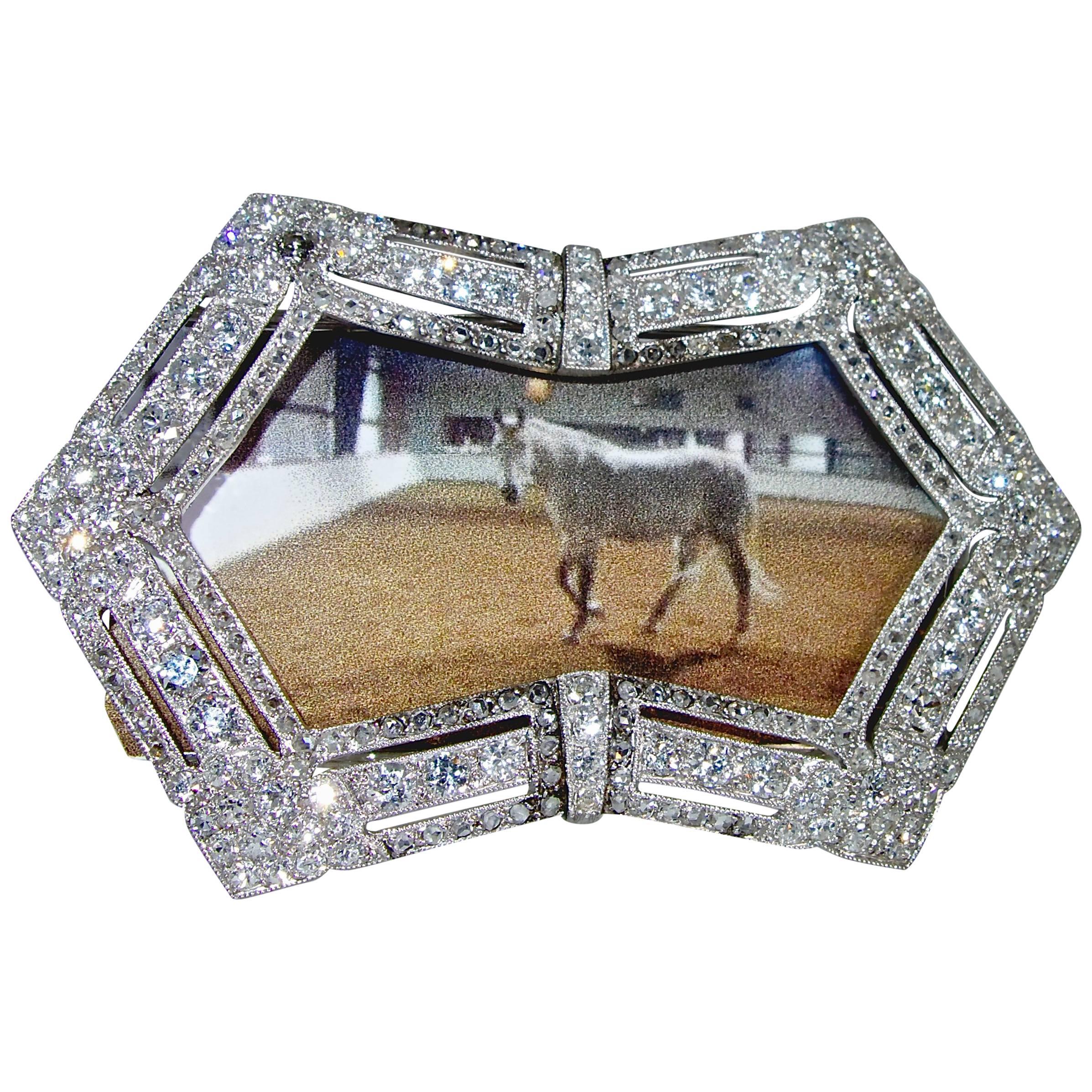 Antique diamond small desk size  frame for pictures is 2.5 inches by 1.5 inches.  It has approximately 5.5 cts of European, mine and rose cut diamonds.  The diamonds are white and bright.  A picture will fit within the back brackets.  this charming