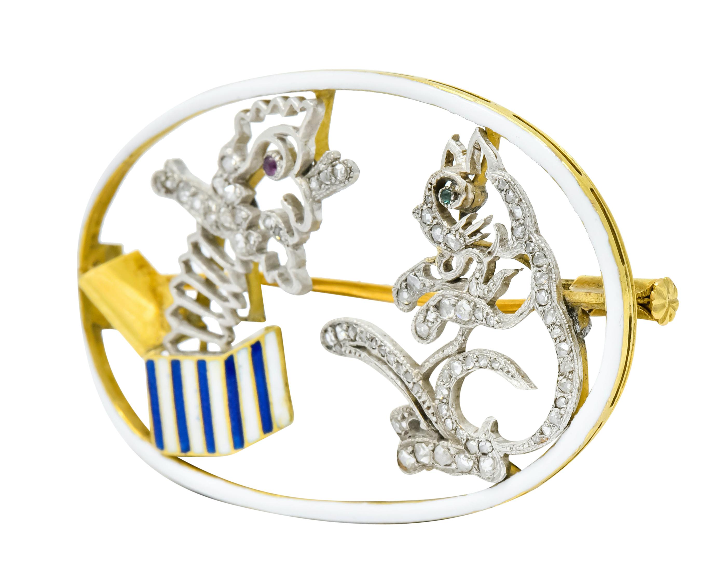Brooch designed as a jack-in-the-box bursting from its box surprising a cat

Box is striped with blue and white enamel with no loss, consistent with age, wear, and use

Both figures feature a milgrain edge and are set throughout with rose cut