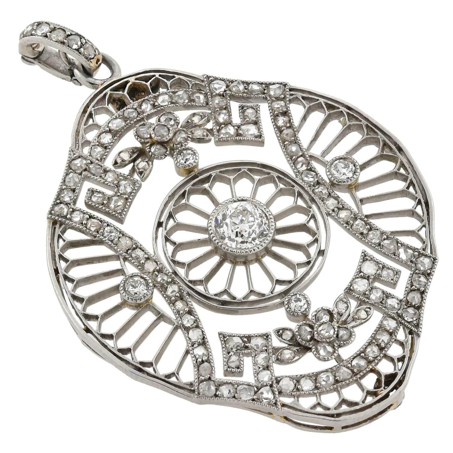 A stunning filigree pendant from the Edwardian (ca1910s) era! This gorgeous French made piece is crafted in platinum and adorns a beautiful 0.55ct old Mine Cut diamond surrounded by feminine wirework in a floral motif. The pendant, which is