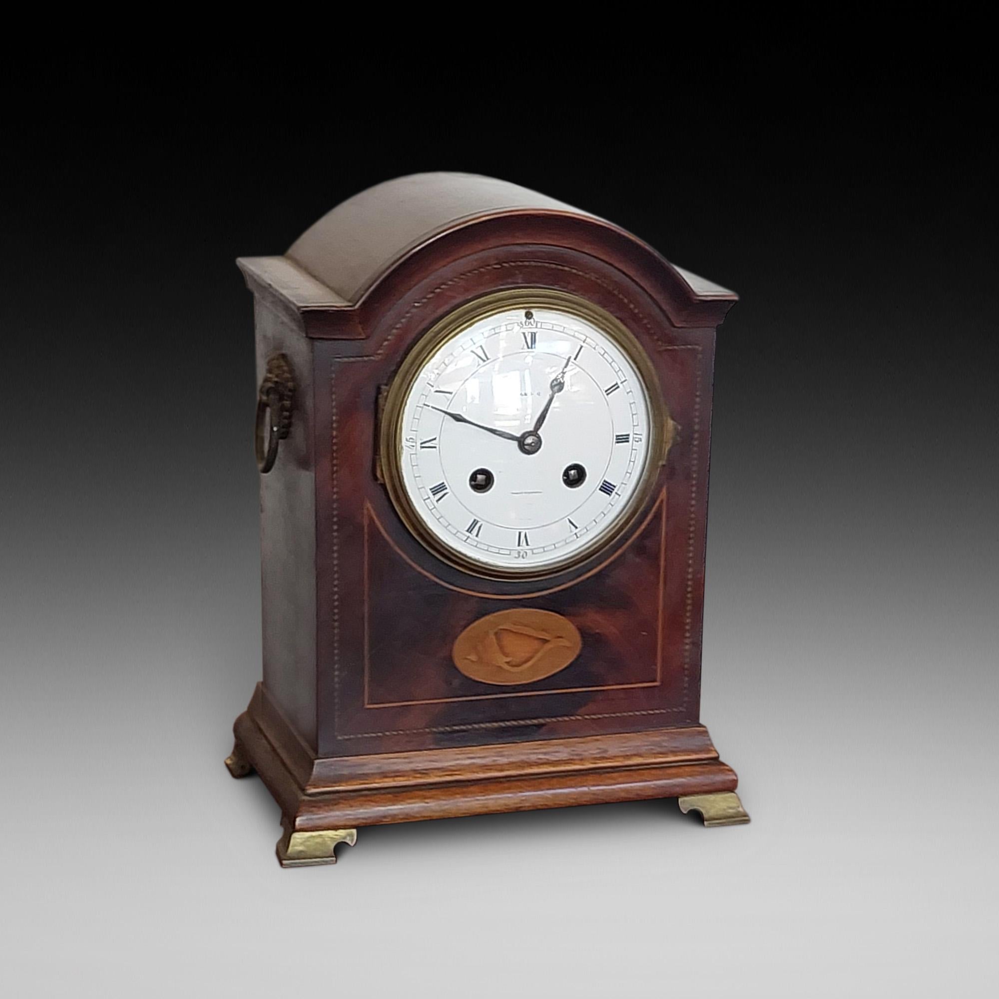 Edwardian French mantel clock with shell inlaid decoration the eight-day duration movement striking the hours on a gong and stamped Ch. Vcne, Paris, 65803, with the dial having black Roman numerals, blued-steel spade hands and signed for the