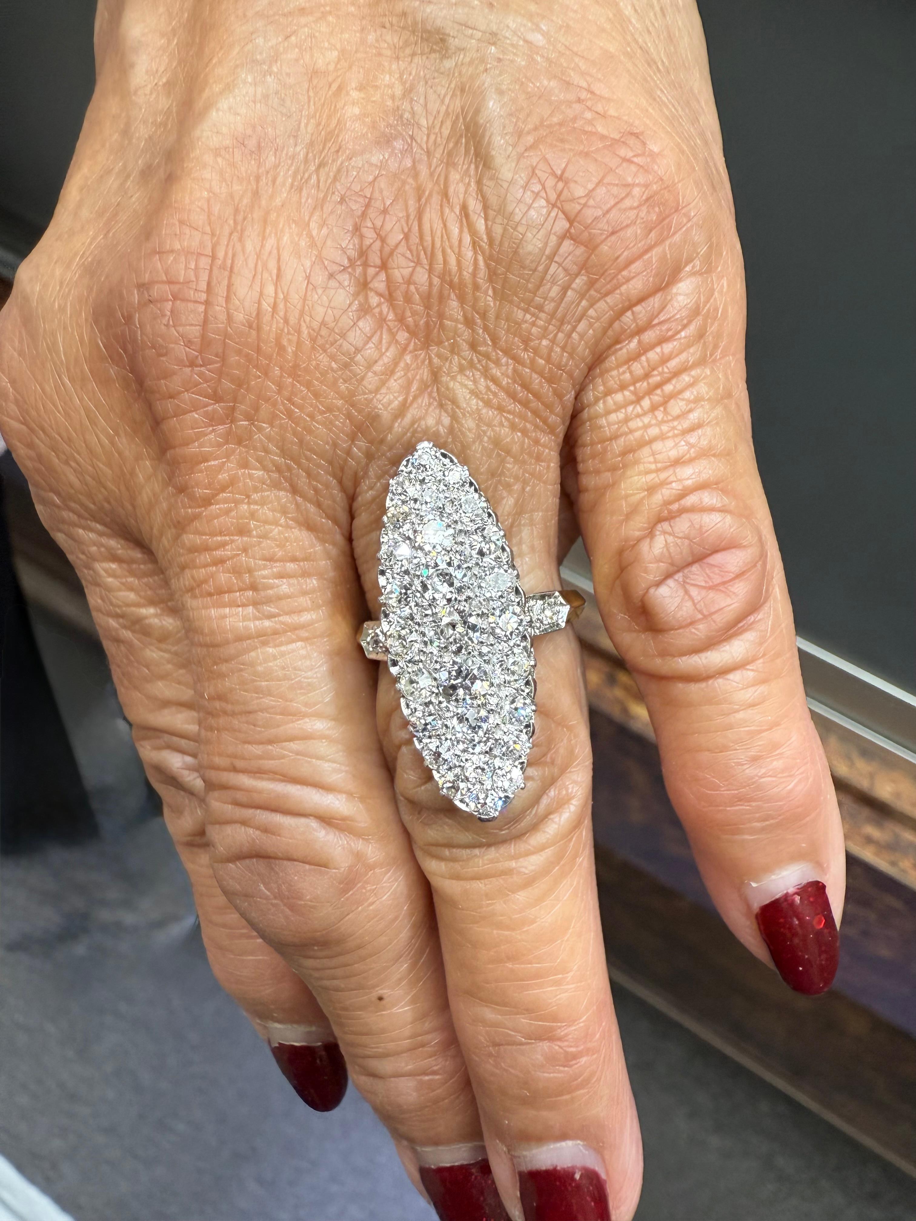 Edwardian French Navette Diamond Cluster Yellow Gold Platinum Ring, circa 1900.

The French Edwardian Navetted Diamond Cluster 18k Yellow Gold and Platinum Ring was made around 1900.  This ring is nicely laid out as it is a bit wider and fuller set