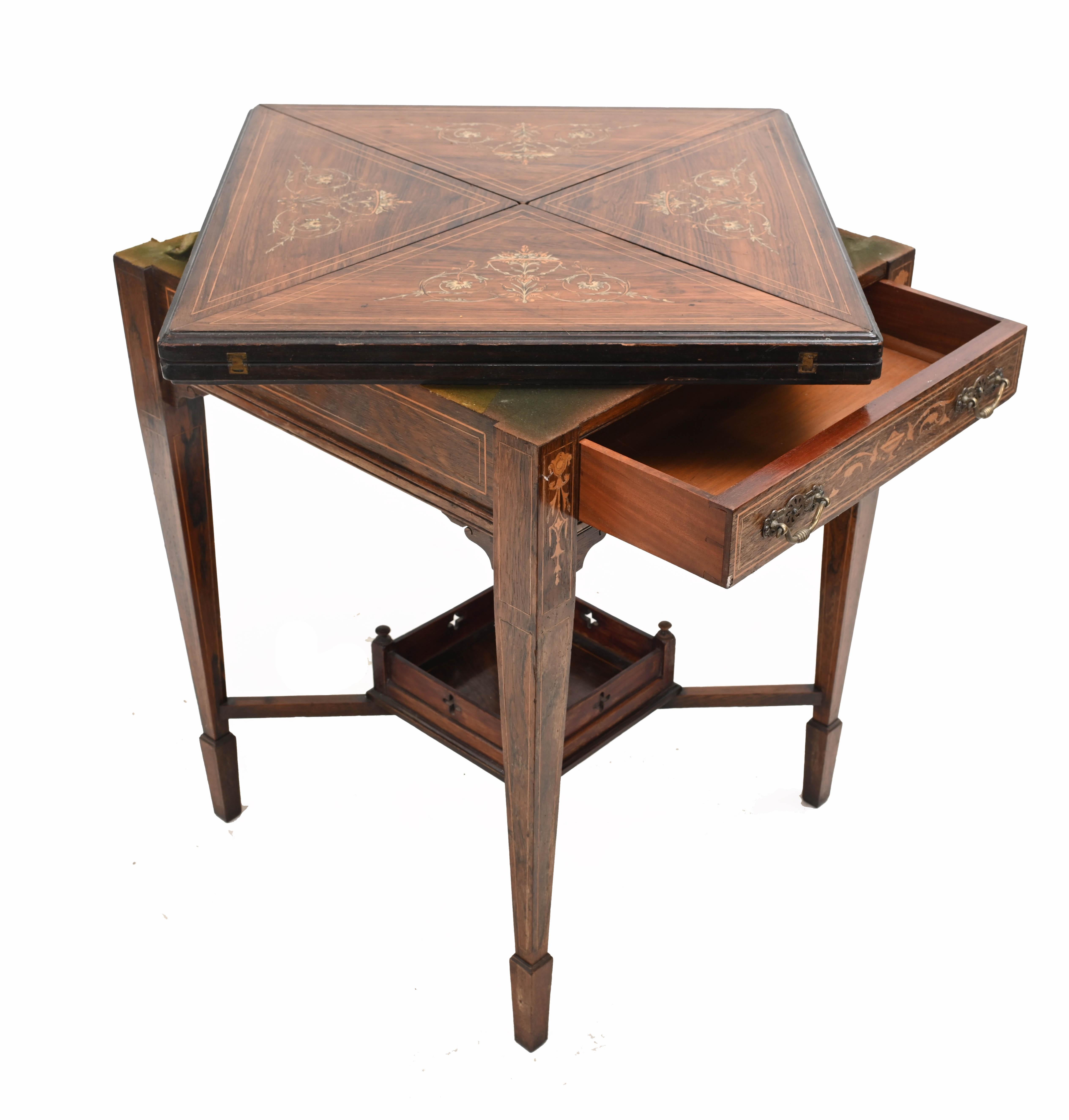 Refined Edwardian games table
Also called an envelope table due to the manner in which it opens out
Hand crafted from rosewood with intricate inlay work
Opens out to reveal game playing surface
Circa 1910
Some of our items are in storage so